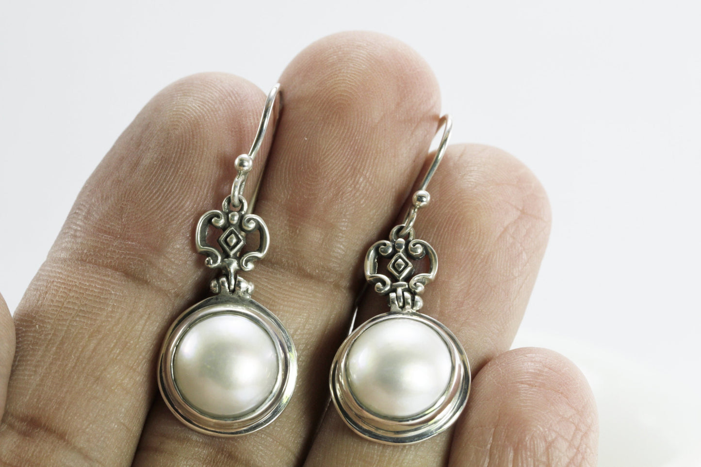 Beautiful white mabe pearl dangle drop earrings set in handmade 925 Sterling silver decorated with filigree crown