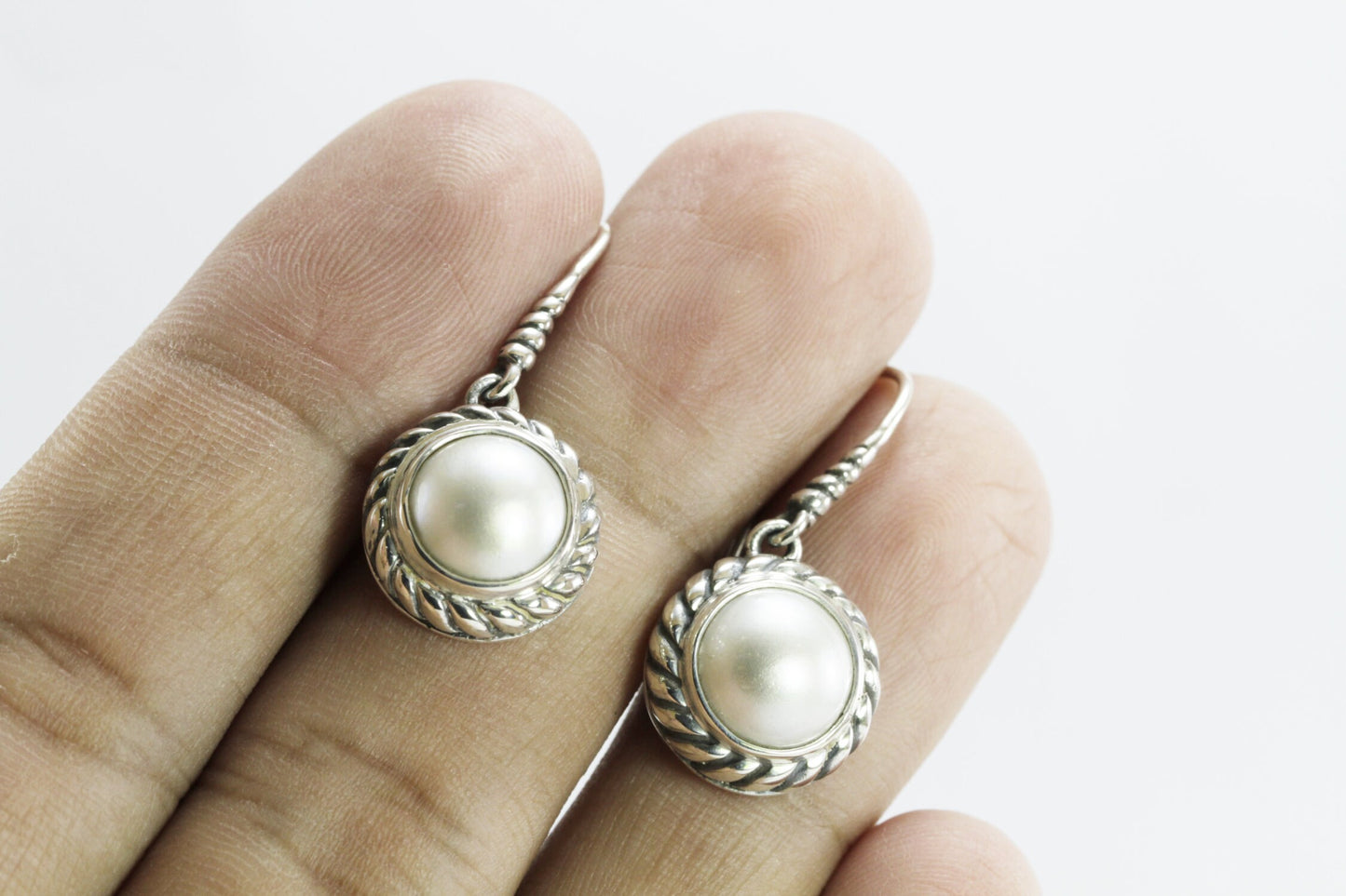 white mabe pearl earrings set in 925 sterling silver 12mm round decorated with cable ornament