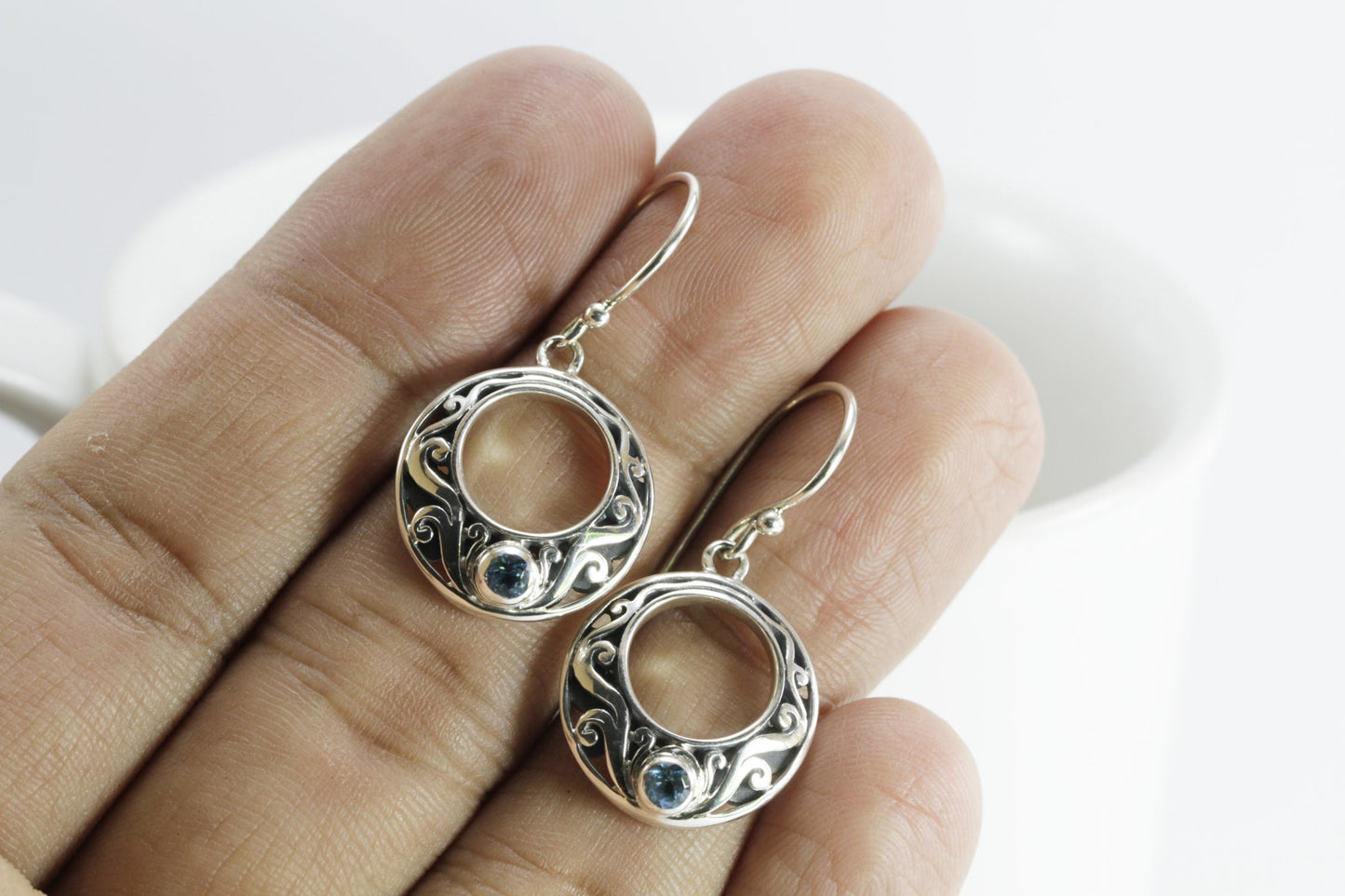 circle earrings with genuine swiss blue topaz set in 925 sterling silver decorated with Bali swirl filigree ornament