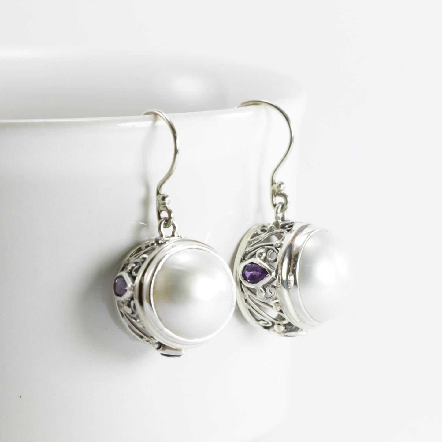 round white mabe pearl earrings decorated with genuine teardrop amethyst set in 925 sterling silver