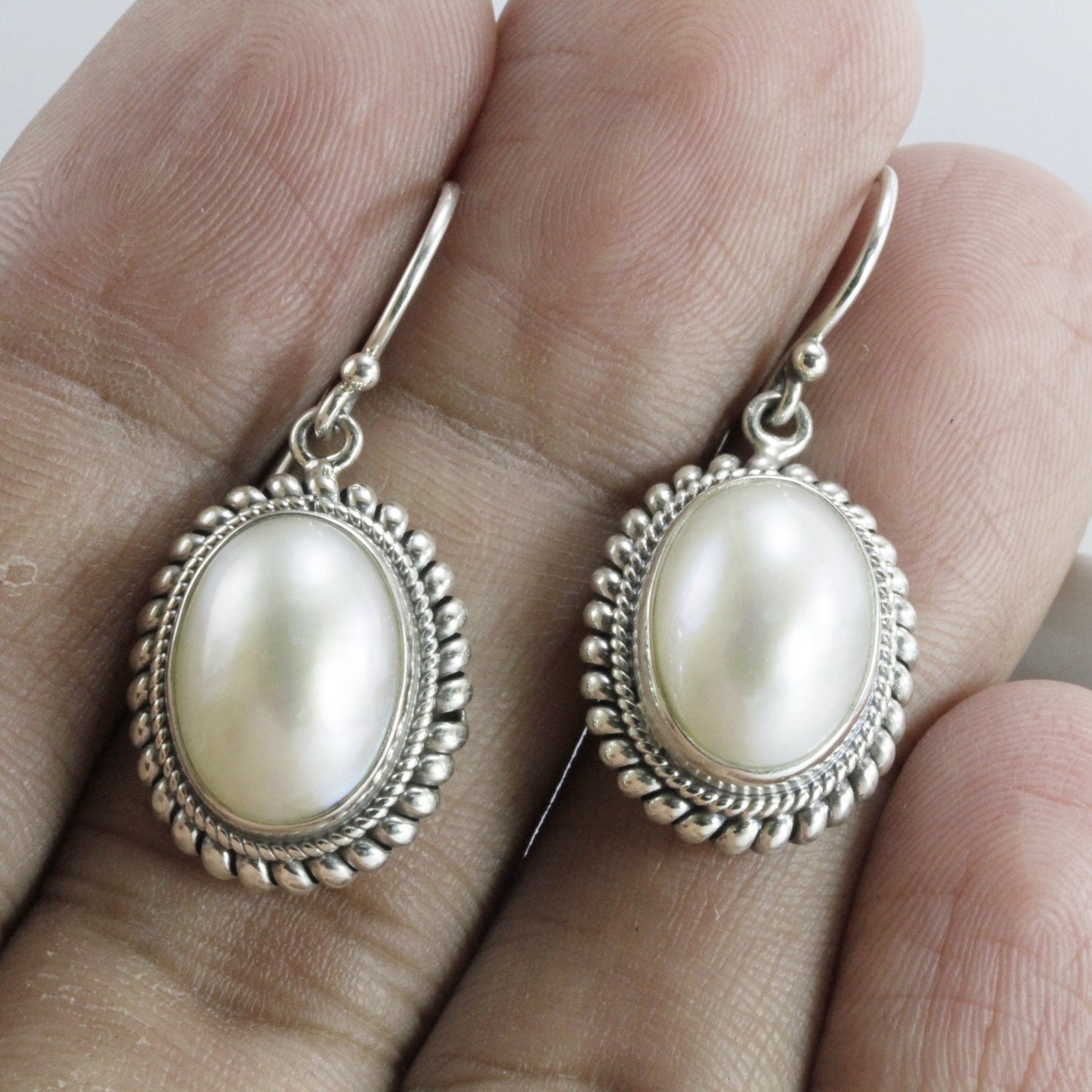 Beautiful dangle drop oval 10*14 mm mabe pearl earrings set in bezel handmade woven cable edge 925 sterling silver, oval pearl earrings