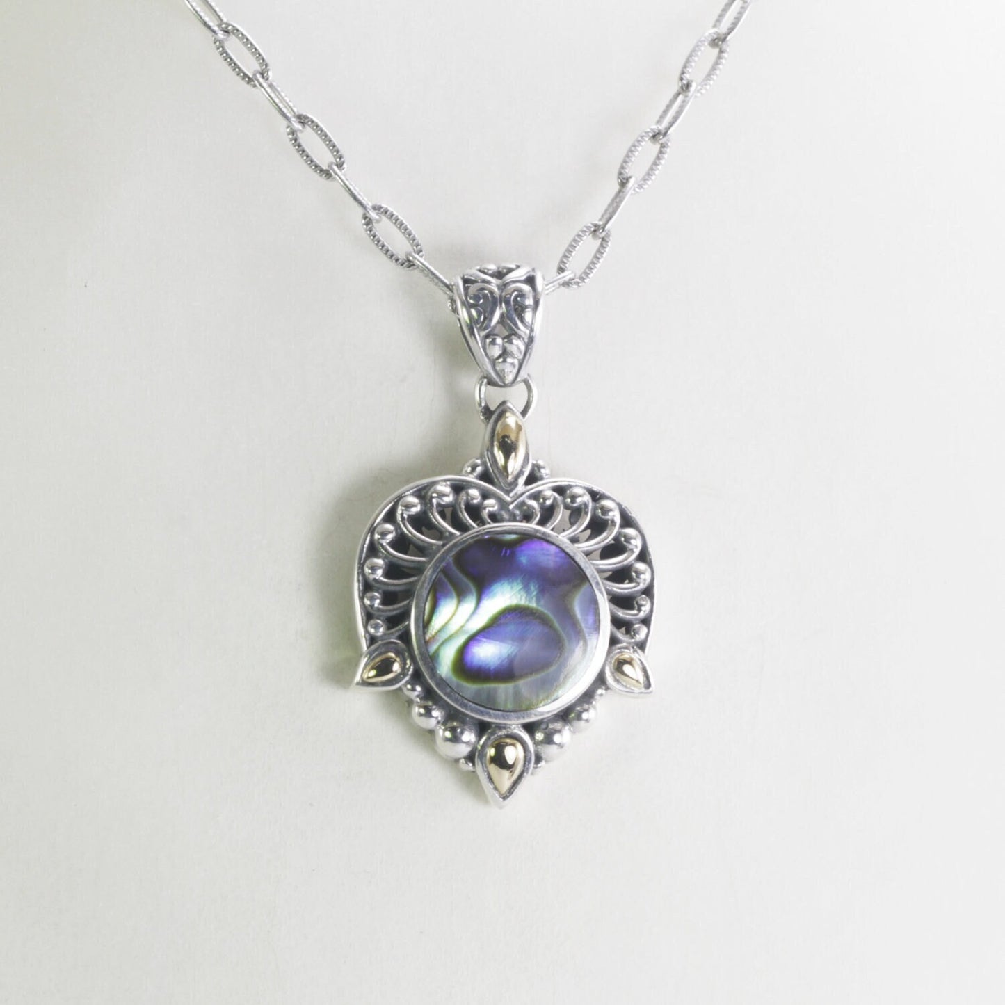 Paua shell necklace pendant set in 925 sterling silver decorated with 18K yellow gold accent and open work filigree