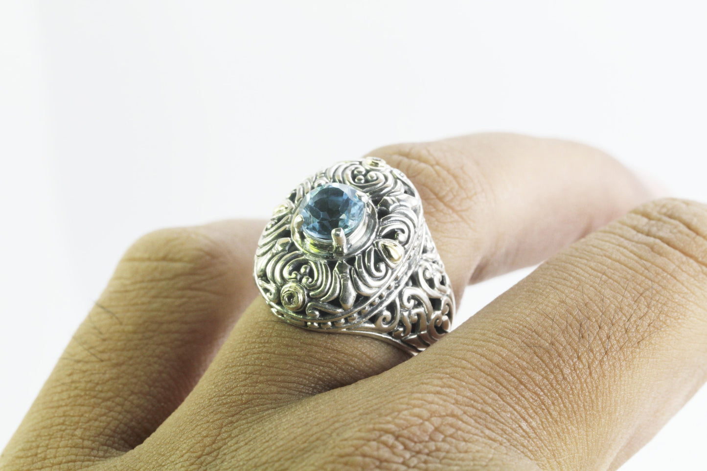 blue topaz ring 925 sterling silver decorated with filigree ornament and 18 K yellow gold