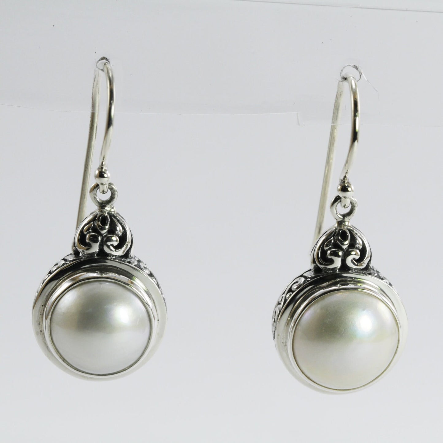 mabe pearl earrings set in 925 sterling silver decorated with filigree ornament