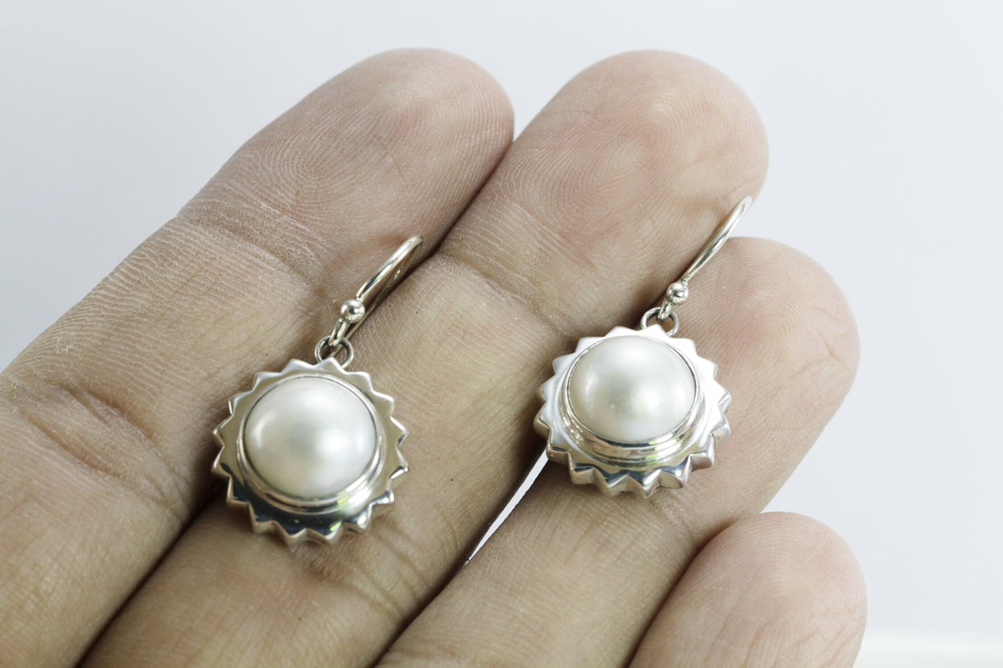 white mabe pearl earrings set in 925 sterling silver