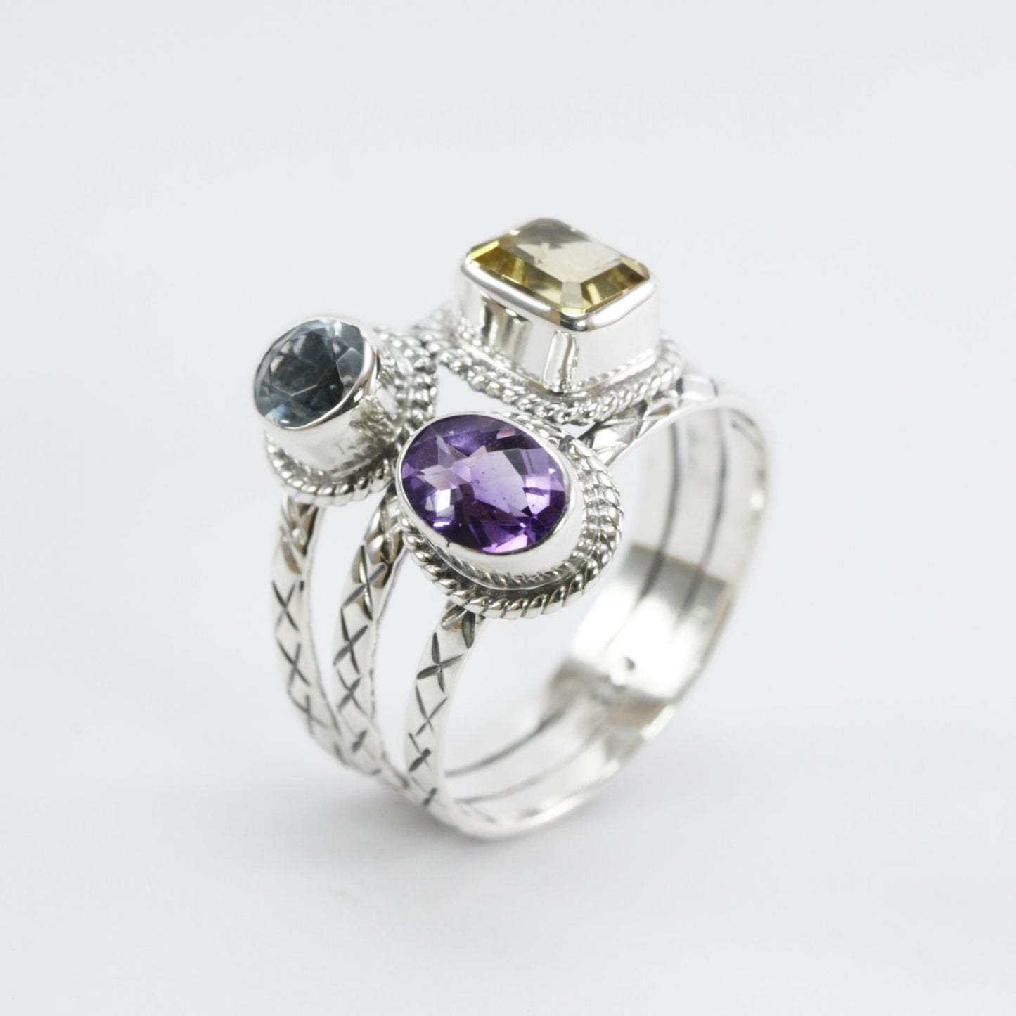 Three stones ring set in 925 sterling silver, combination of natural amethyst, citrine, and blue topaz decorated with cable rope