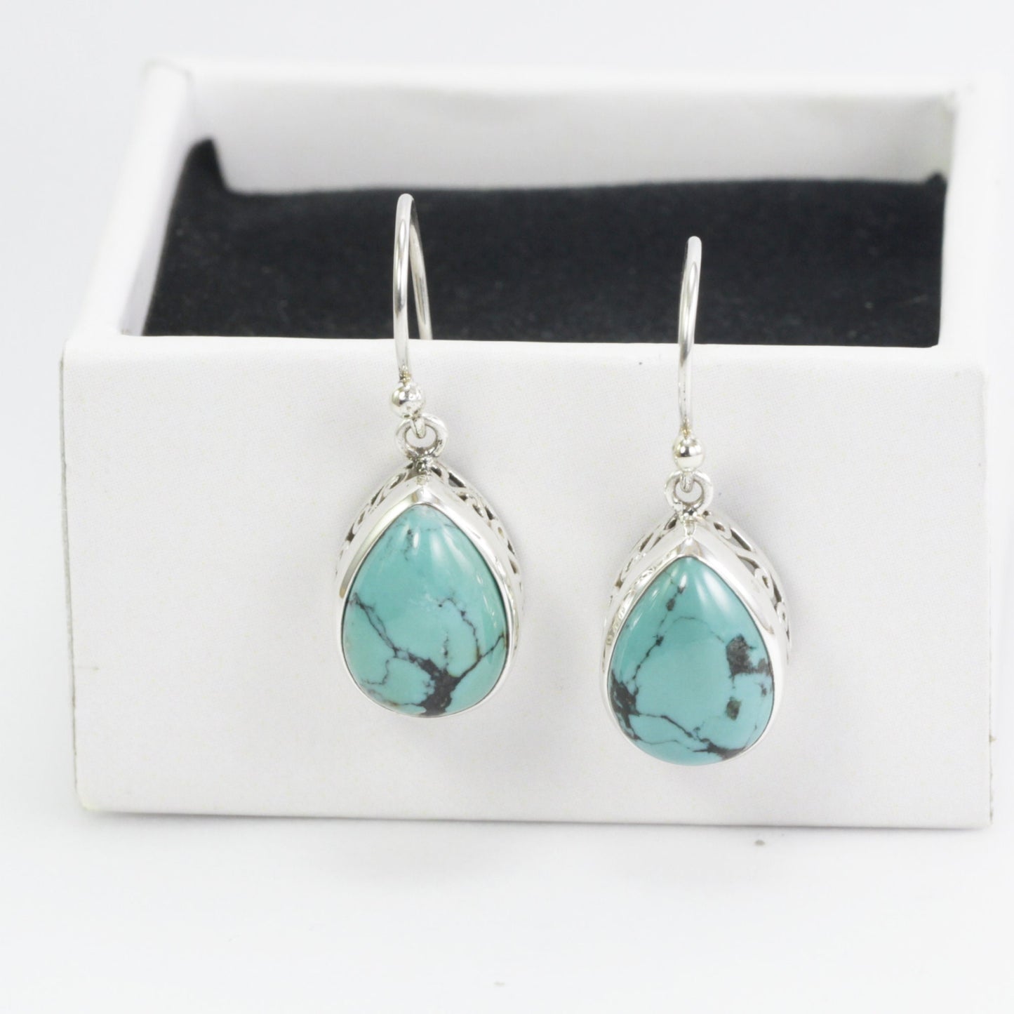Teardrop Turquoise Dangling Earrings set in 925 Sterling Silver Decorated with filigree handmade bezel