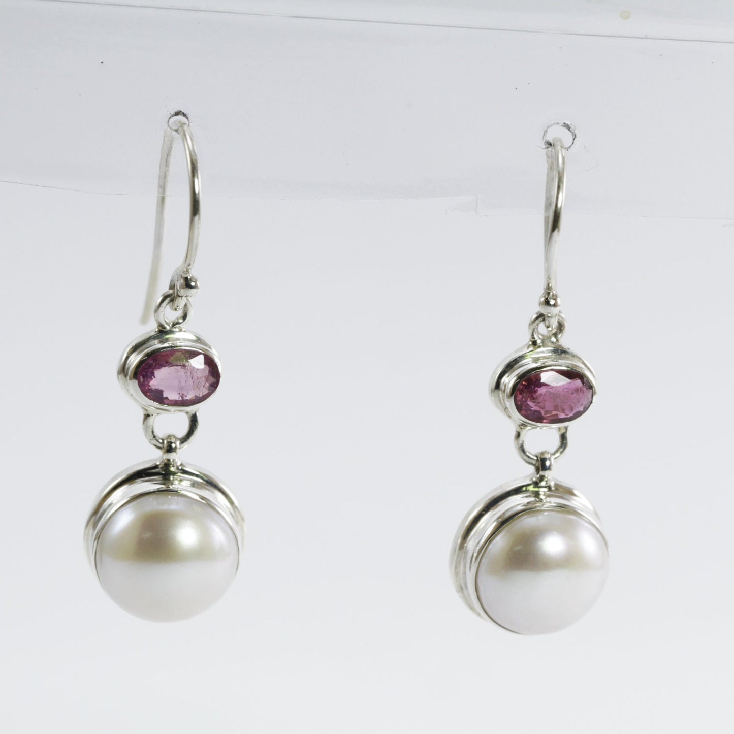 freshwater pearl earrings set in 925 sterling silver with genuine blue topaz