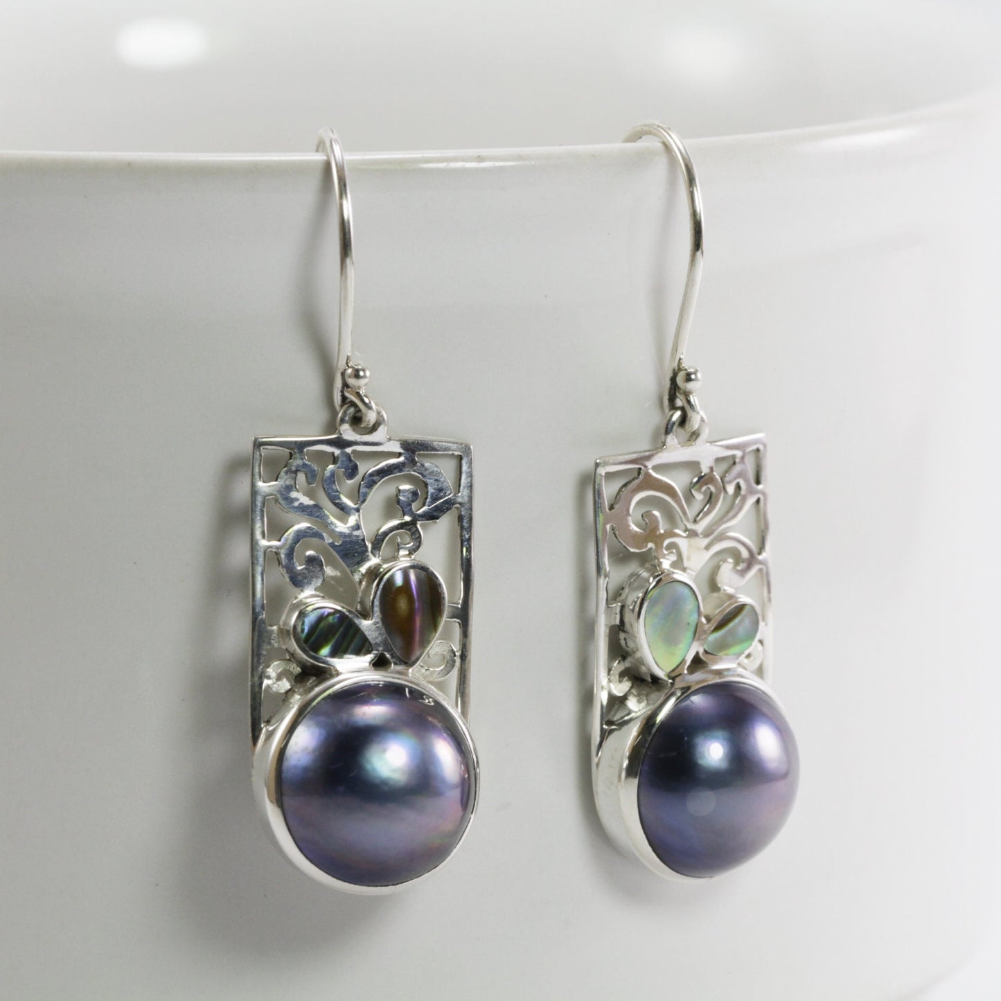 white mabe pearl earrings set in 925 sterling silver decorated with created opal and ornament filigree