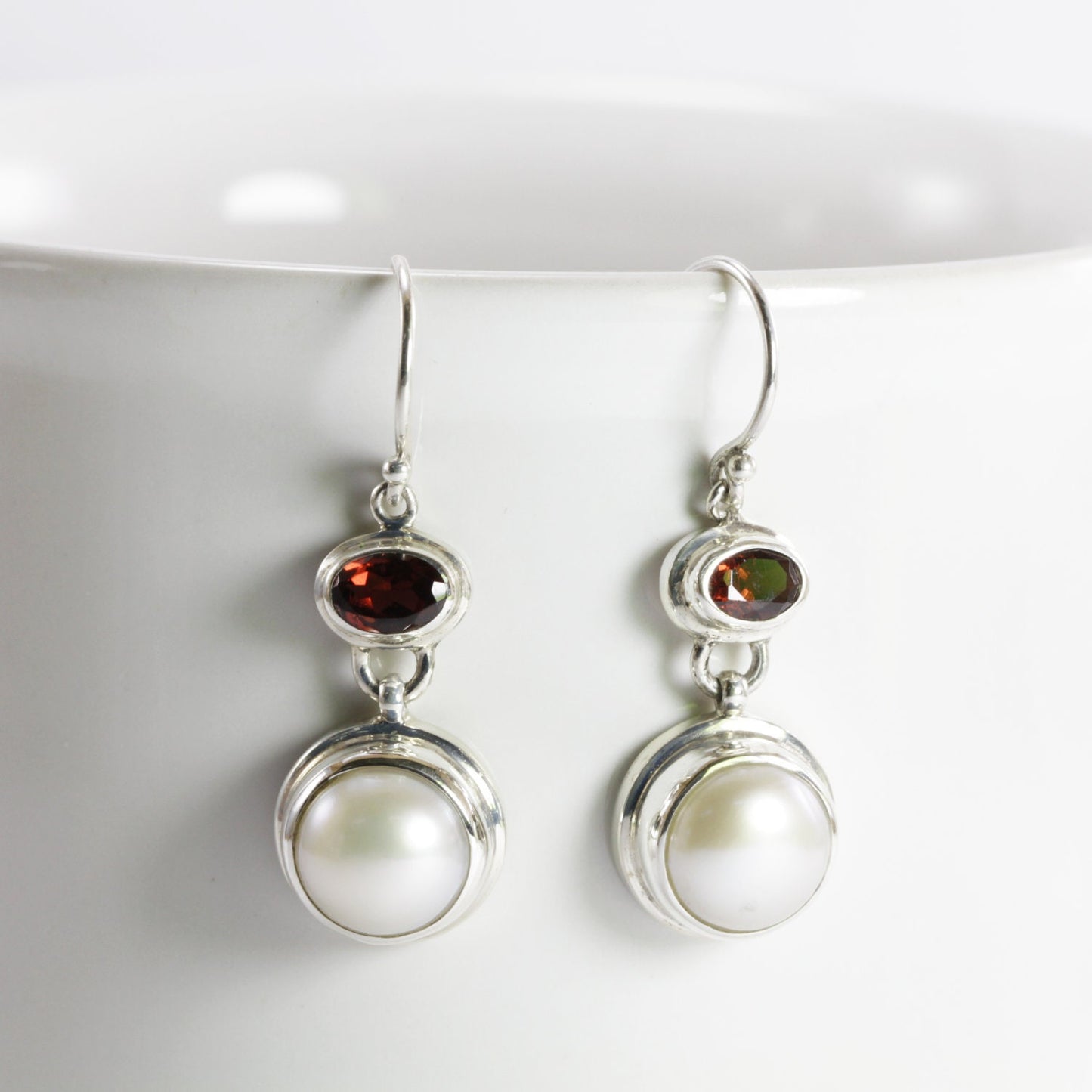 freshwater pearl earrings set in 925 sterling silver with genuine blue topaz