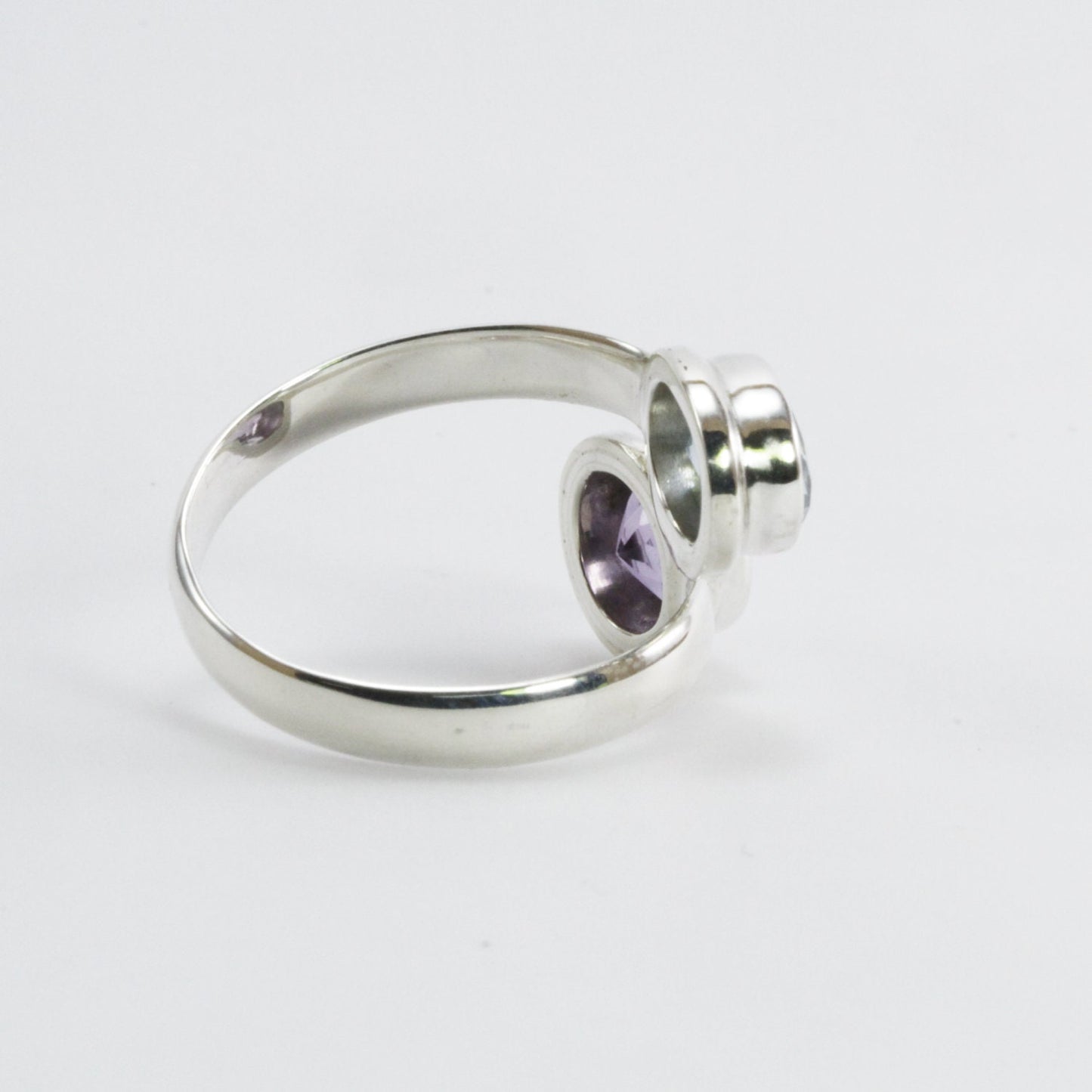 bypass ring with round blue topaz and amethyst bezel set in 925 sterling silver, adjustable promise ring