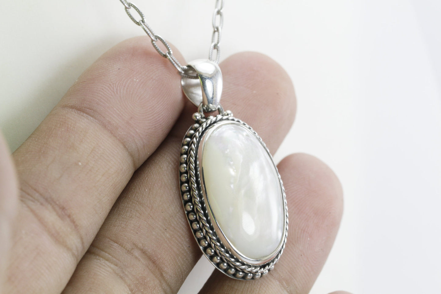 mother of pearl pendant necklace 26*16 mm width set in handmade 925 sterling silver decorated with cable and dot edge