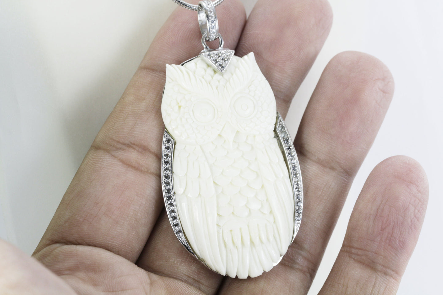 Owl Pendant necklace bone carving decorated with white topaz set in 925 sterling silver