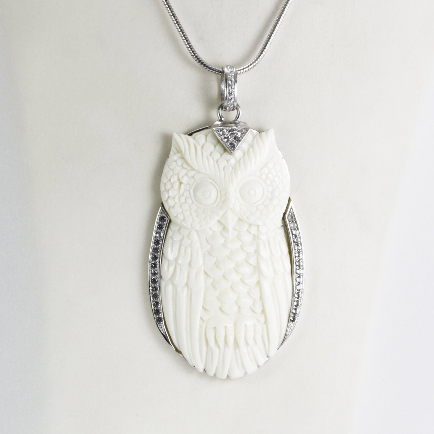Owl Pendant necklace bone carving decorated with white topaz set in 925 sterling silver