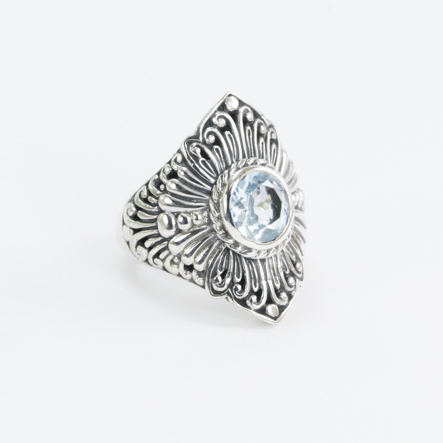 Wide band ring for women with round blue topaz set in 925 sterling silver decorated with filigree carving