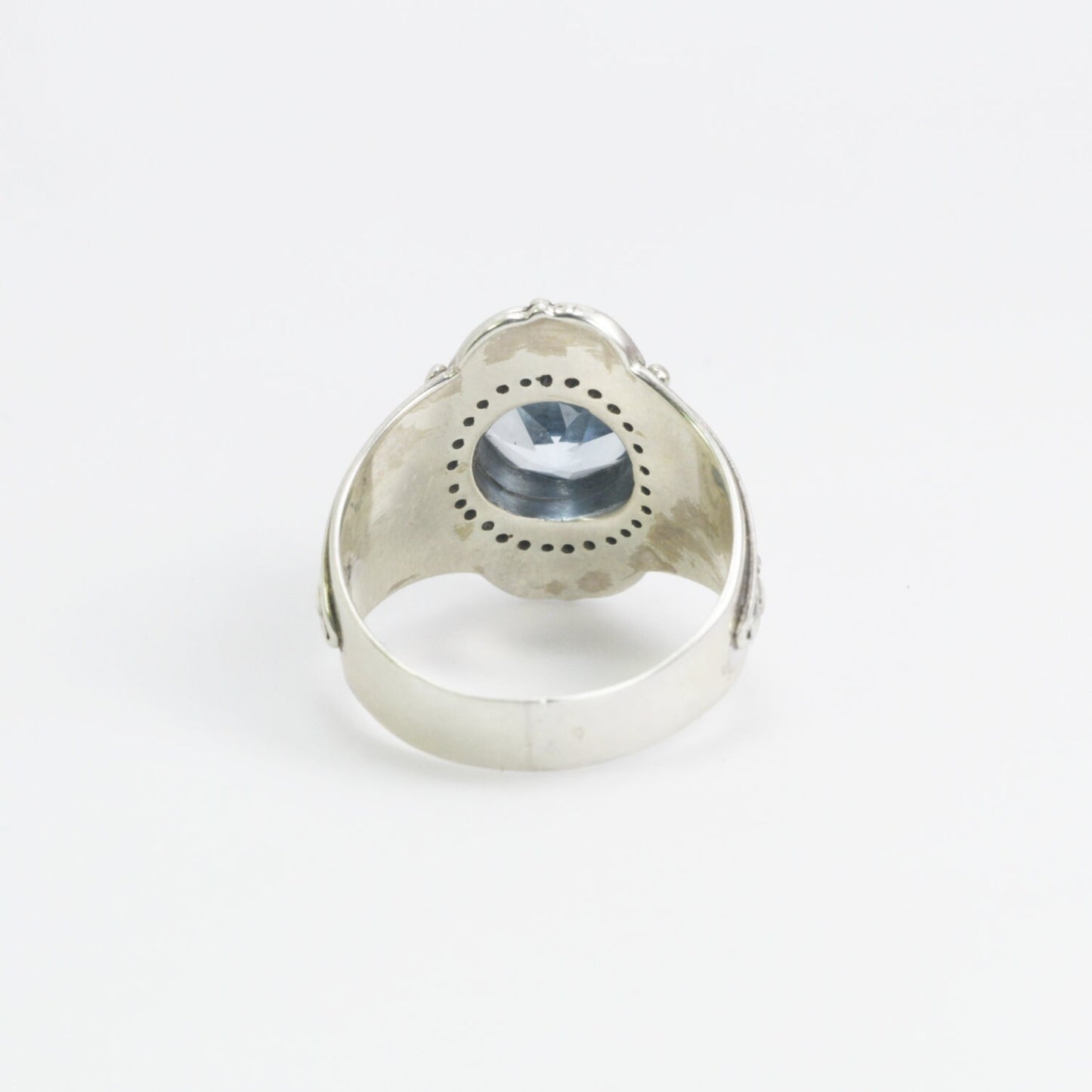 blue topaz ring set in 925 sterling silver decorated with white topaz and ornament filigree