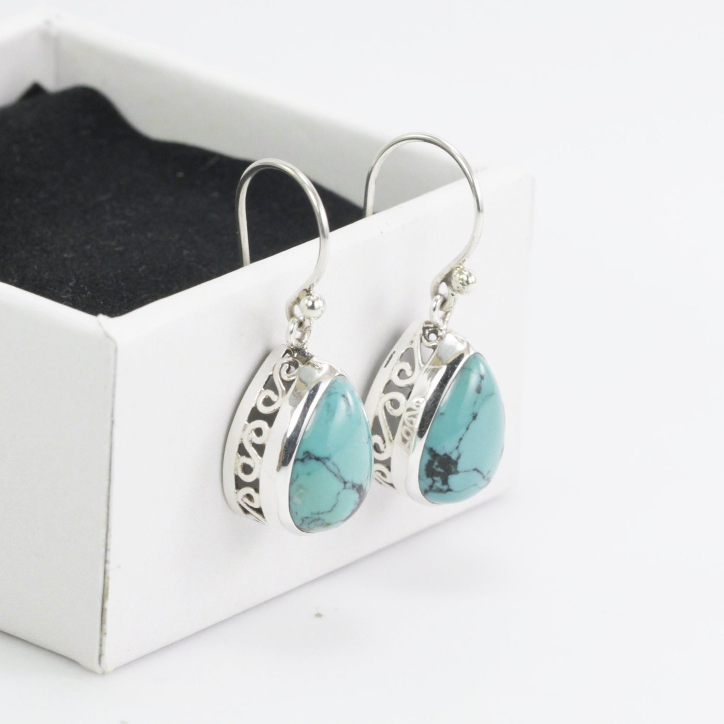 Teardrop Turquoise Dangling Earrings set in 925 Sterling Silver Decorated with filigree handmade bezel