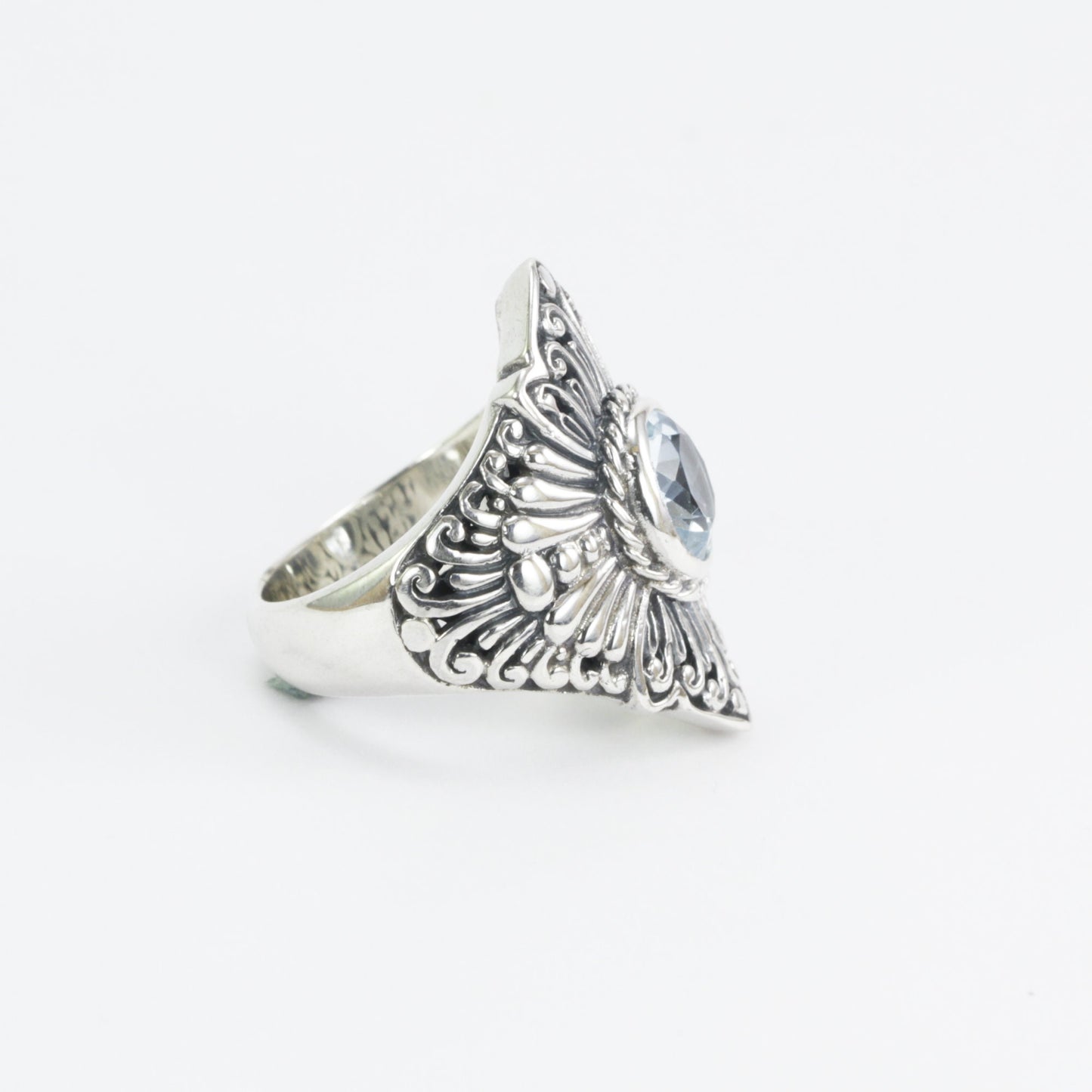Wide band ring for women with round blue topaz set in 925 sterling silver decorated with filigree carving