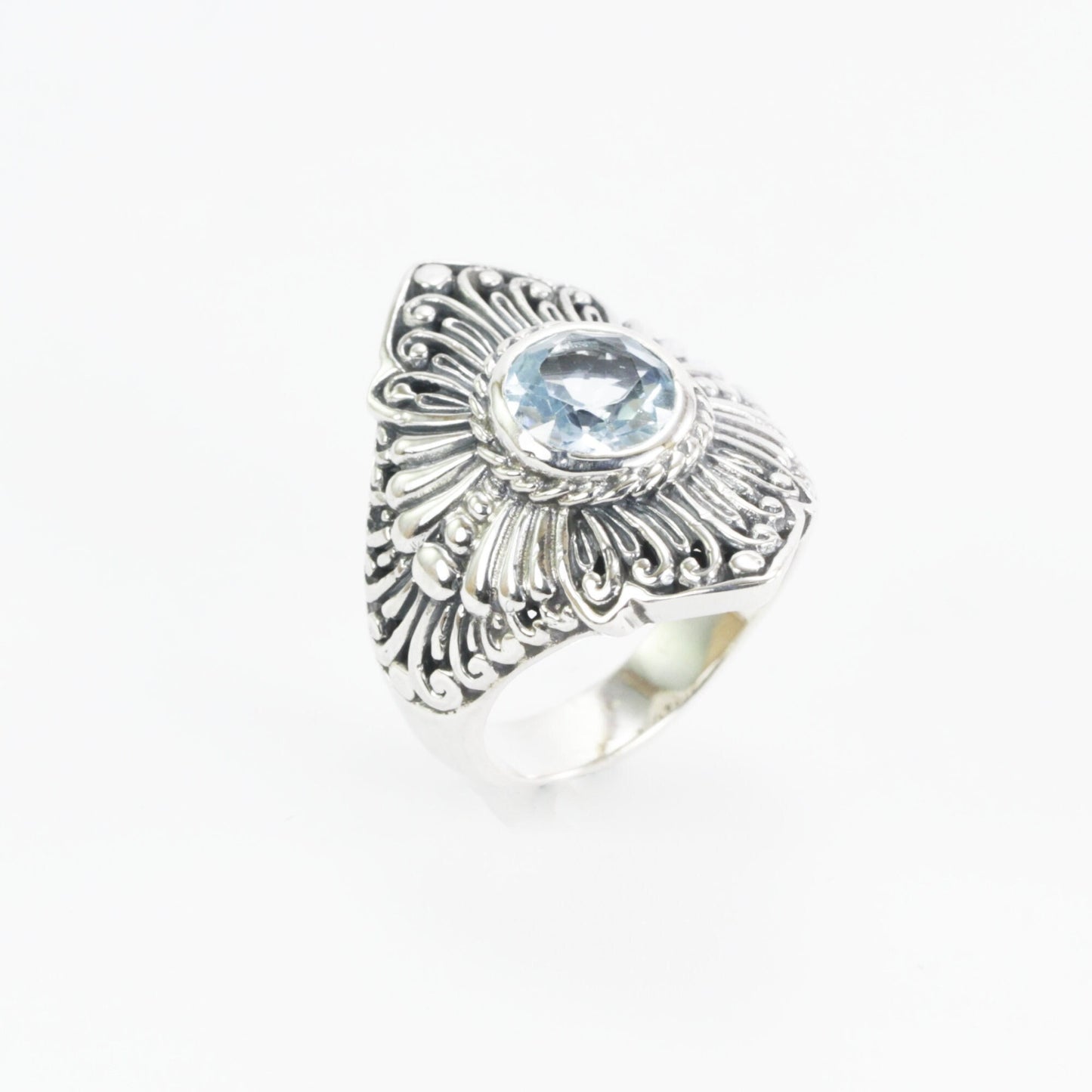 Wide band ring for women with round blue topaz set in 925 sterling silver decorated with filigree carving