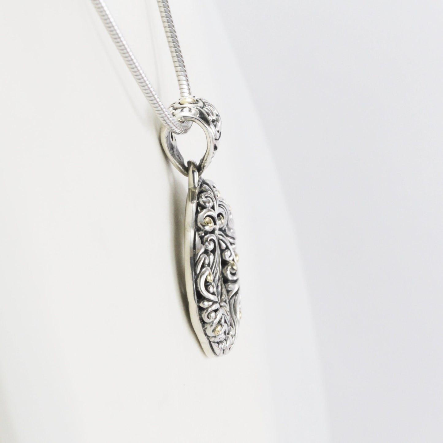 infinity pendant with open work filigree ornament in 925 sterling silver and 18k Yellow gold accent,