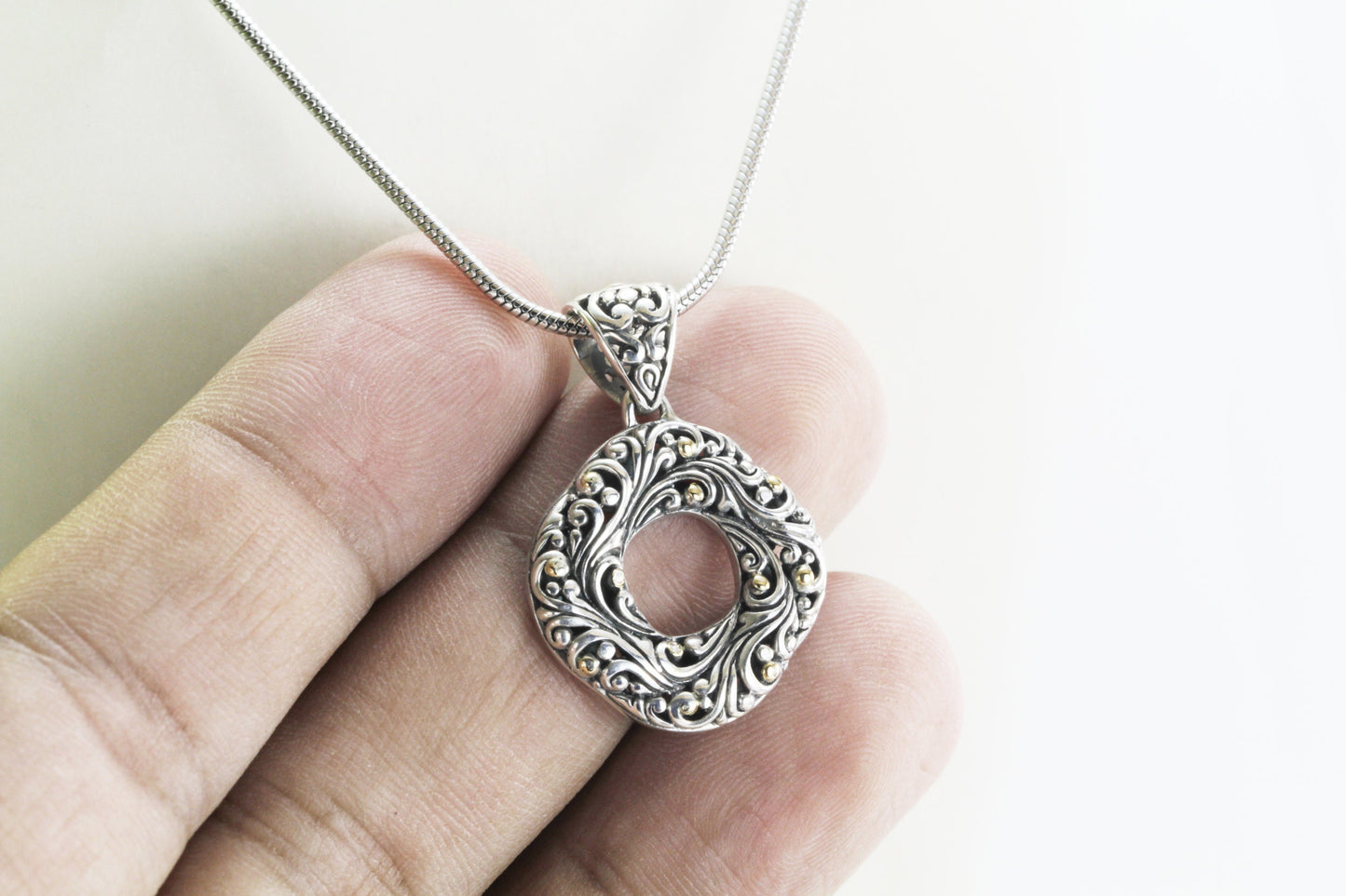 infinity pendant with open work filigree ornament in 925 sterling silver and 18k Yellow gold accent,