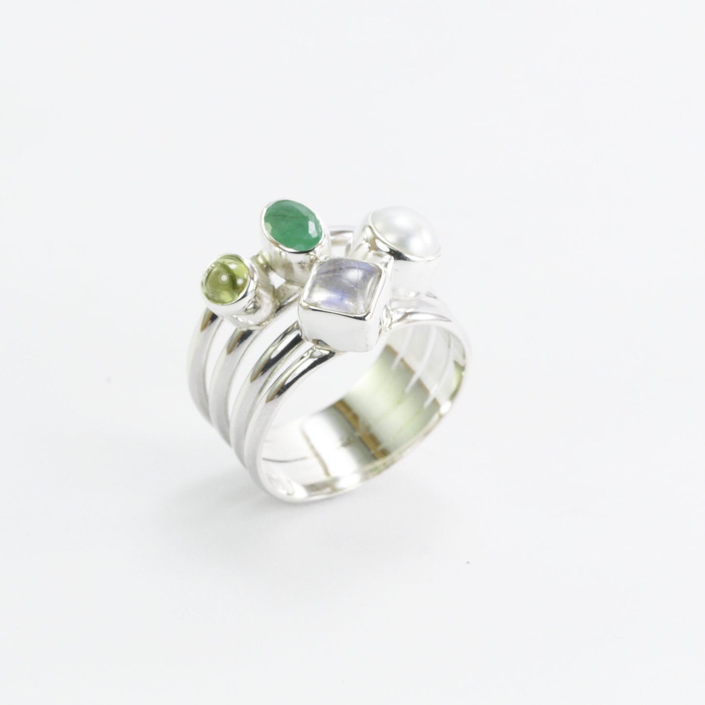 multi stone ring with emerald, peridot, moonstone, and fresh water pearl set in 925 sterling silver
