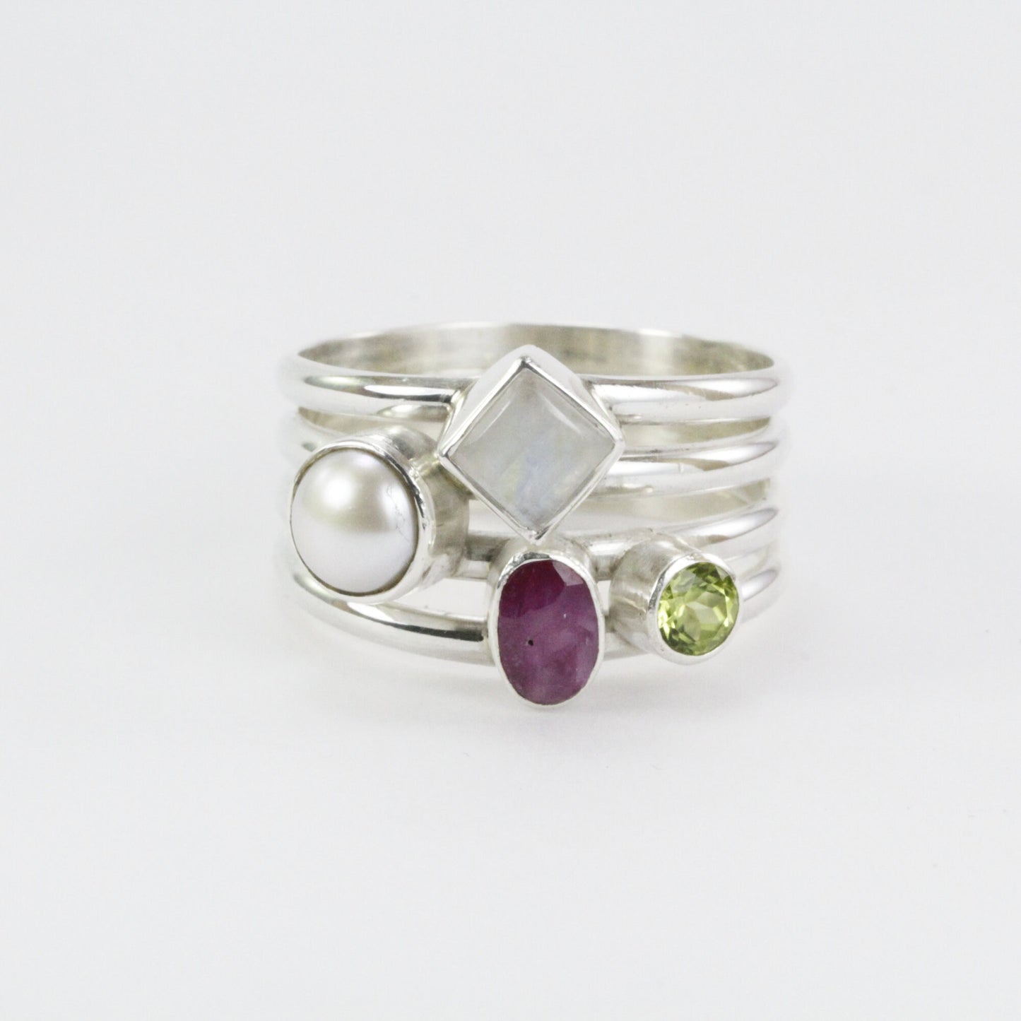 multi stone ring with ruby, peridot, moonstone, and fresh water pearl set in 925 sterling silver