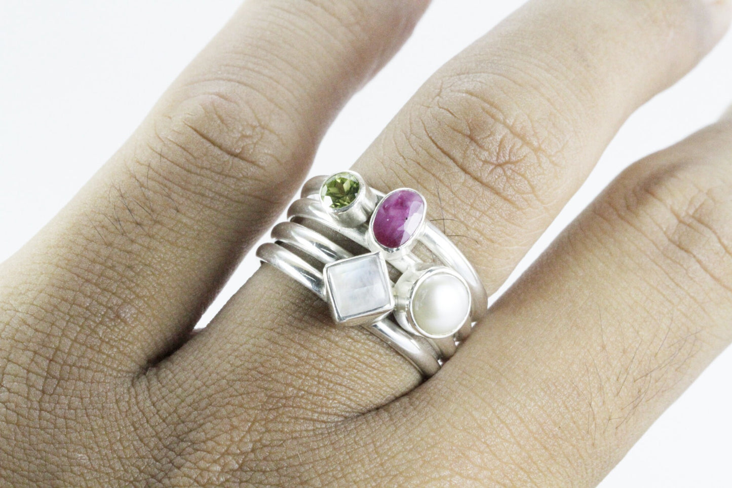 multi stone ring with ruby, peridot, moonstone, and fresh water pearl set in 925 sterling silver