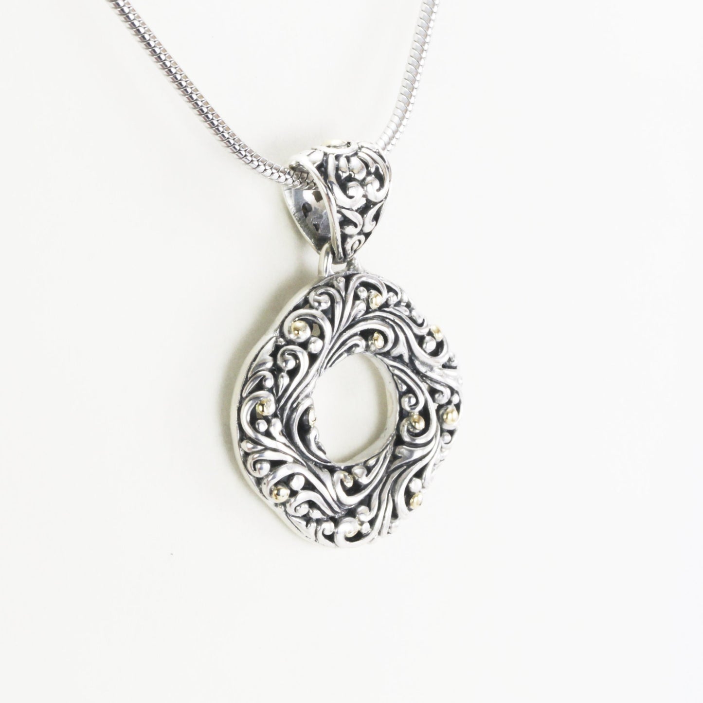 infinity pendant with open work filigree ornament in 925 sterling silver and 18k Yellow gold accent,