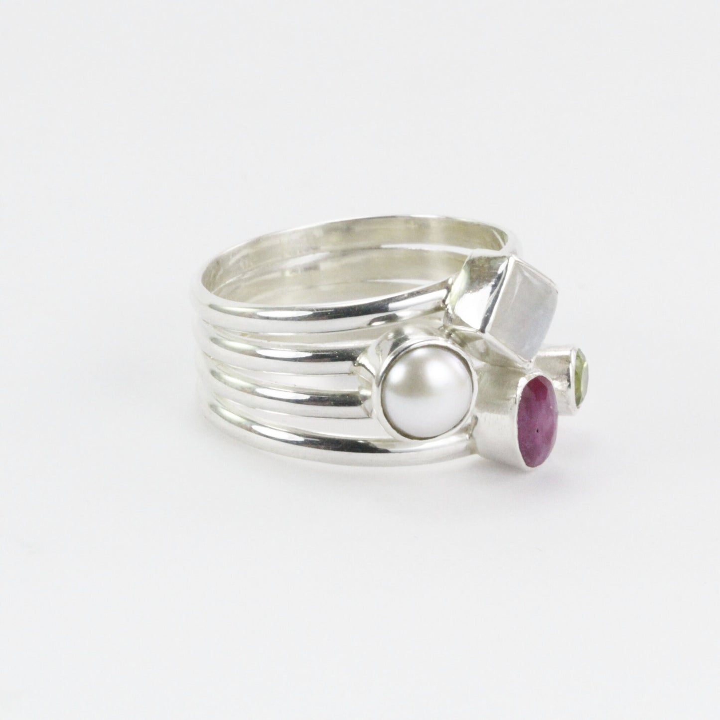 multi stone ring with ruby, peridot, moonstone, and fresh water pearl set in 925 sterling silver