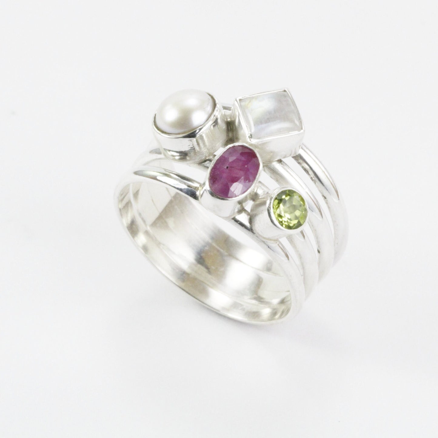 multi stone ring with ruby, peridot, moonstone, and fresh water pearl set in 925 sterling silver