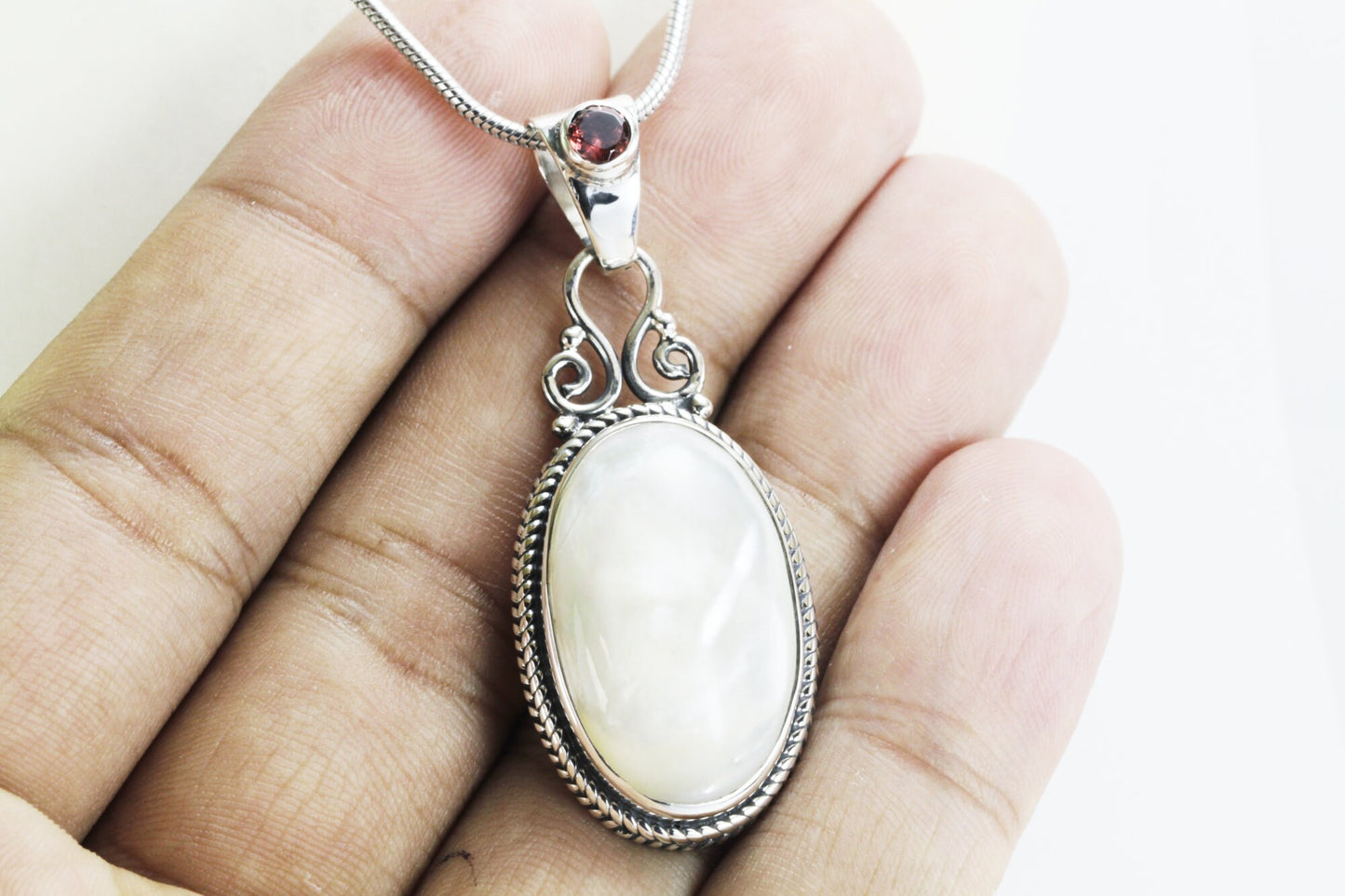 Mother of pearl pendant necklace with genuine red garnet set in 925 sterling silver cable chain rope