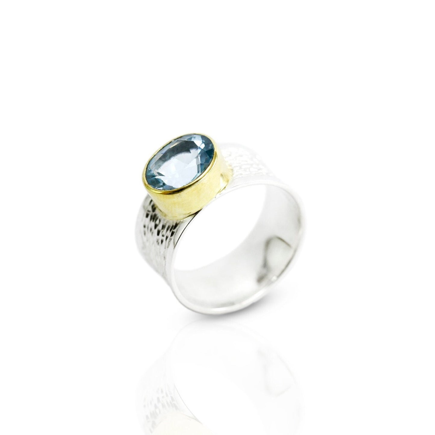 Wide band ring with genuine blue topaz decorated with gold vermeil