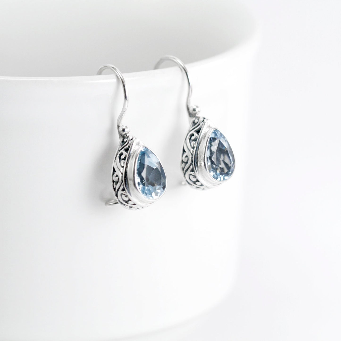 Teardrop earrings kidney lock with genuine blue topaz set in 925 sterling silver decorated with swirl filigree