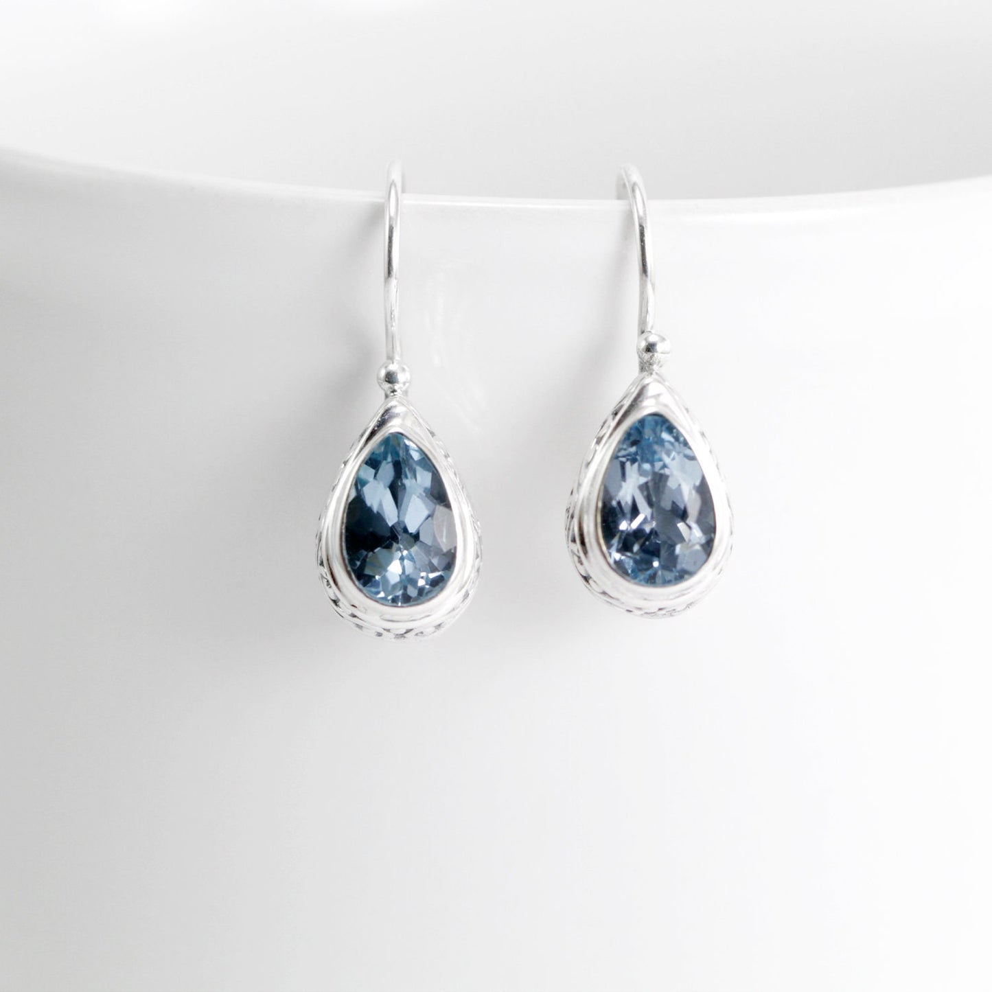 Teardrop earrings kidney lock with genuine blue topaz set in 925 sterling silver decorated with swirl filigree