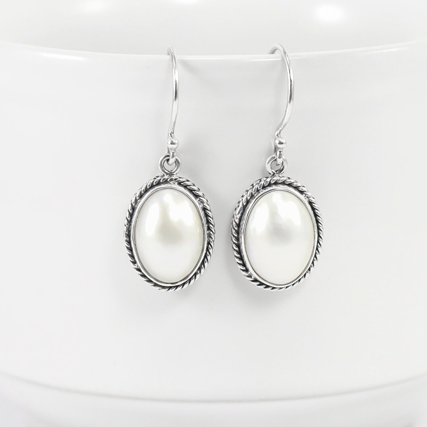 oval mabe pearl earrings 925 sterling silver decorated with woven chain edge