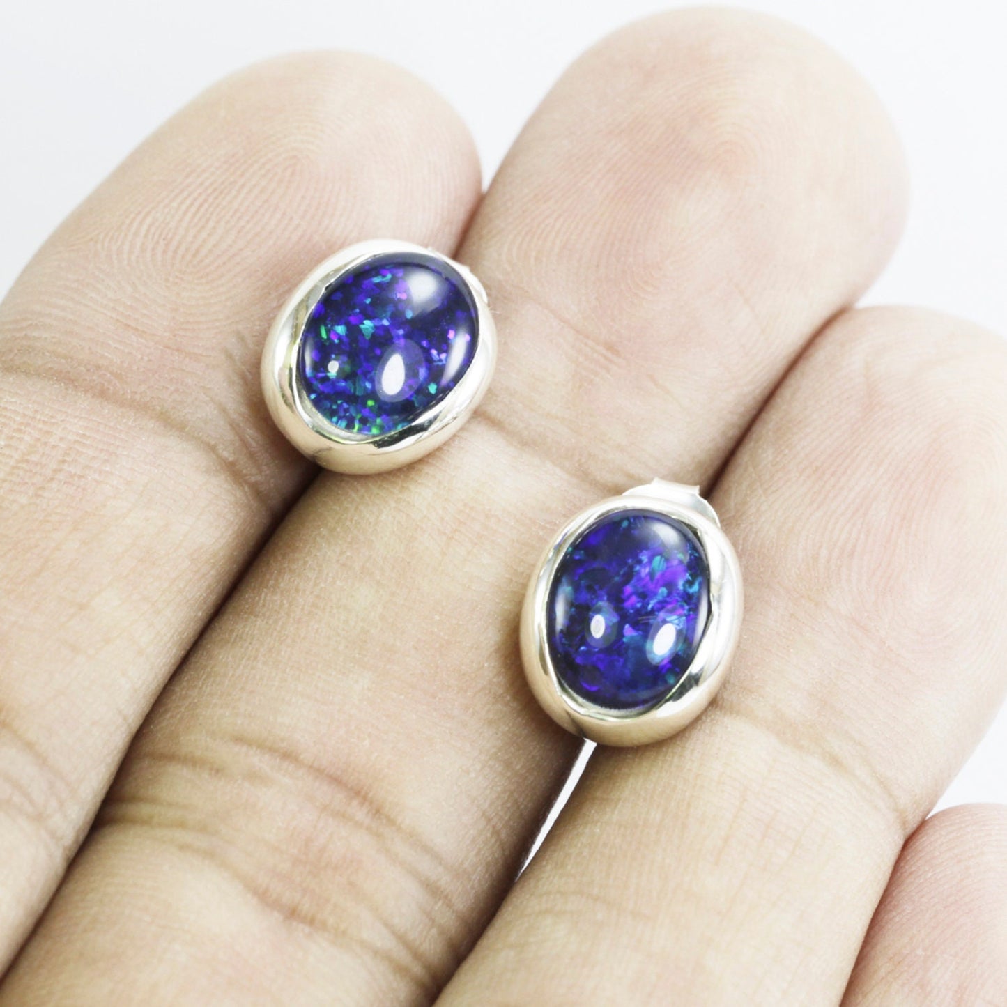 blue fire opal stud earrings set in 925 sterling silver 9*10 mm oval shape