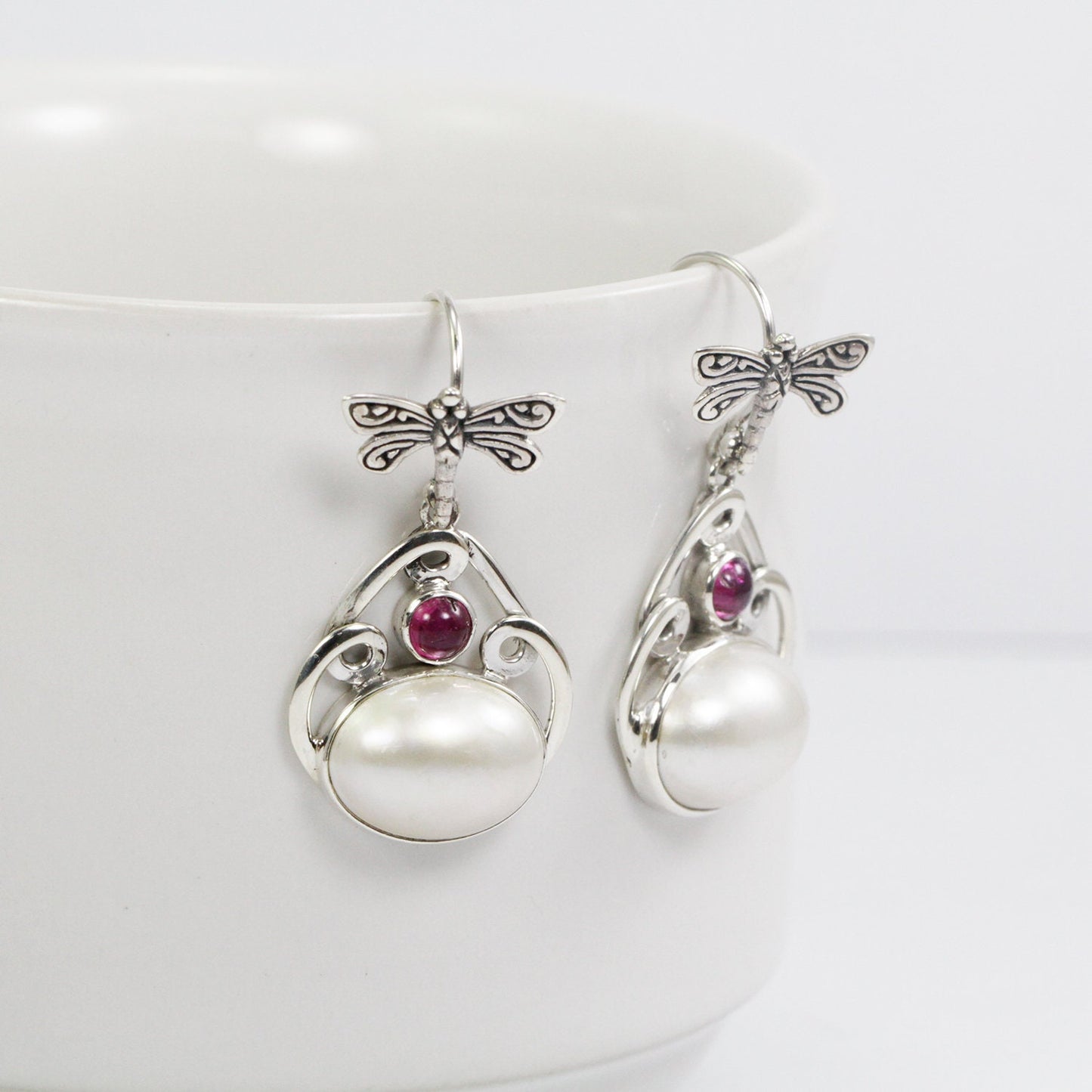 Beautiful dangle drop dragonfly earrings with genuine white mabe pearl and natural pink tourmaline,