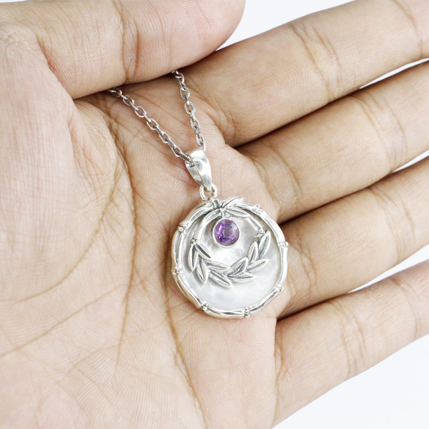 amethyst pendant with 925 sterling silver leaf frame and decorated with genuine white shell