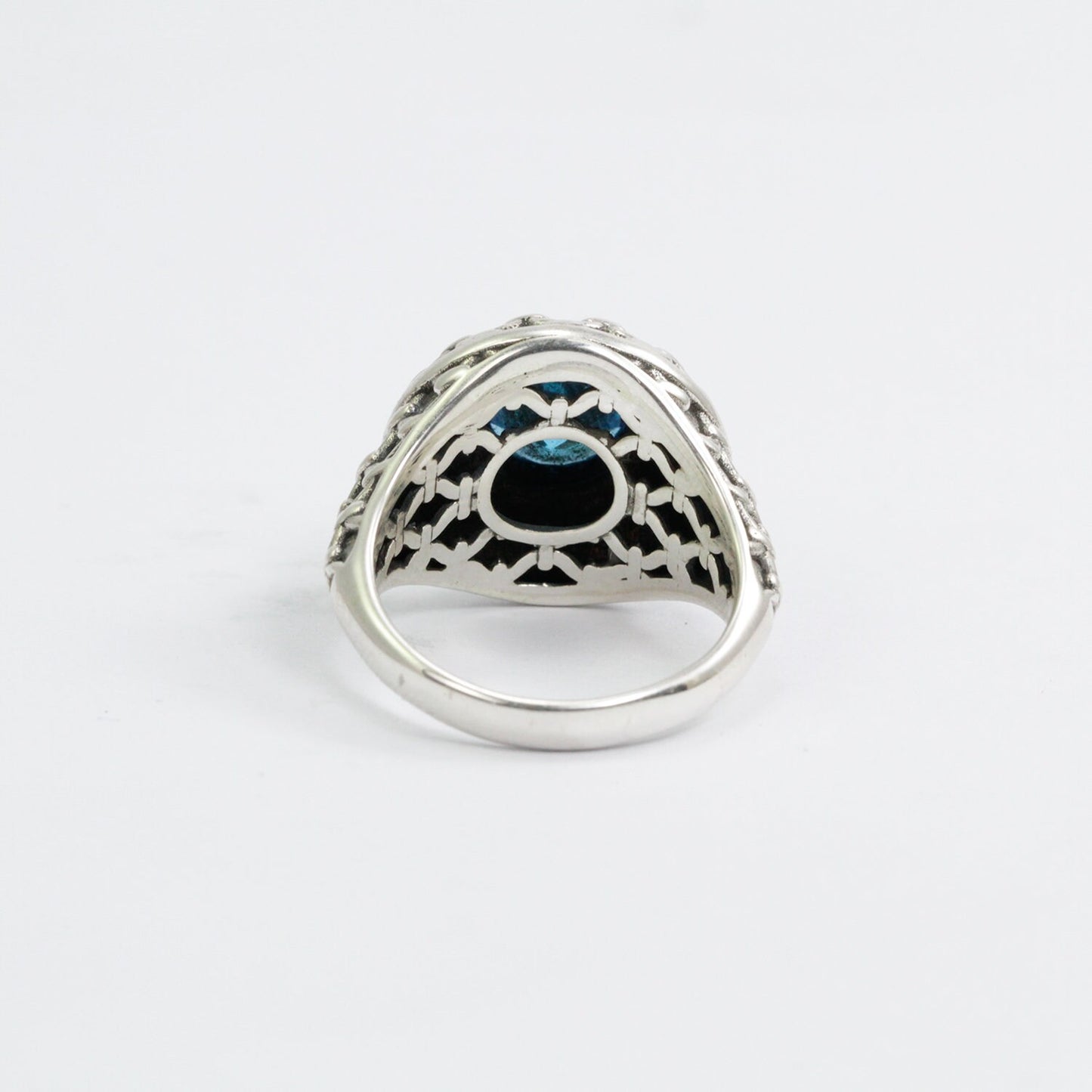 doom ring with genuine blue topaz zirconia decorated with woven web ornament