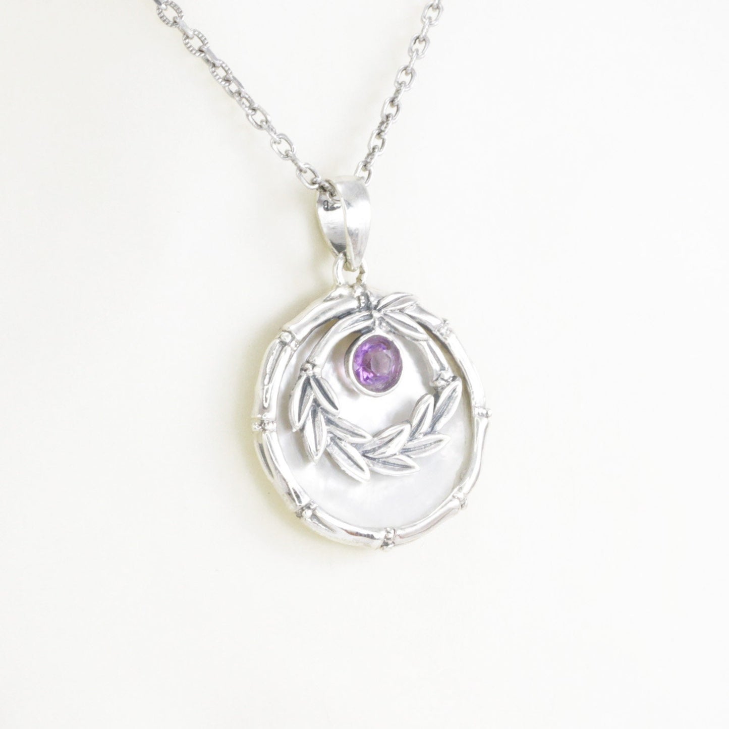 amethyst pendant with 925 sterling silver leaf frame and decorated with genuine white shell