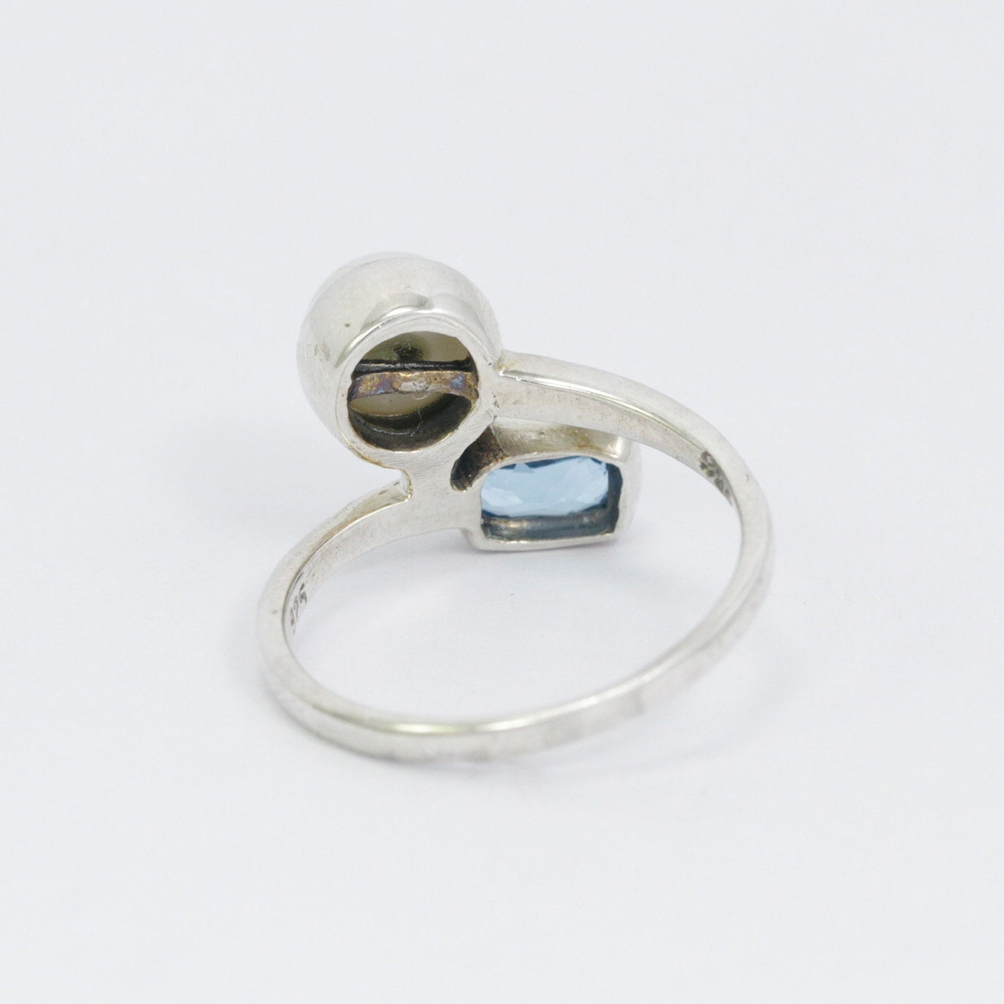 bypass ring with genuine blue topaz and freshwater pearl set in 925 sterling silver