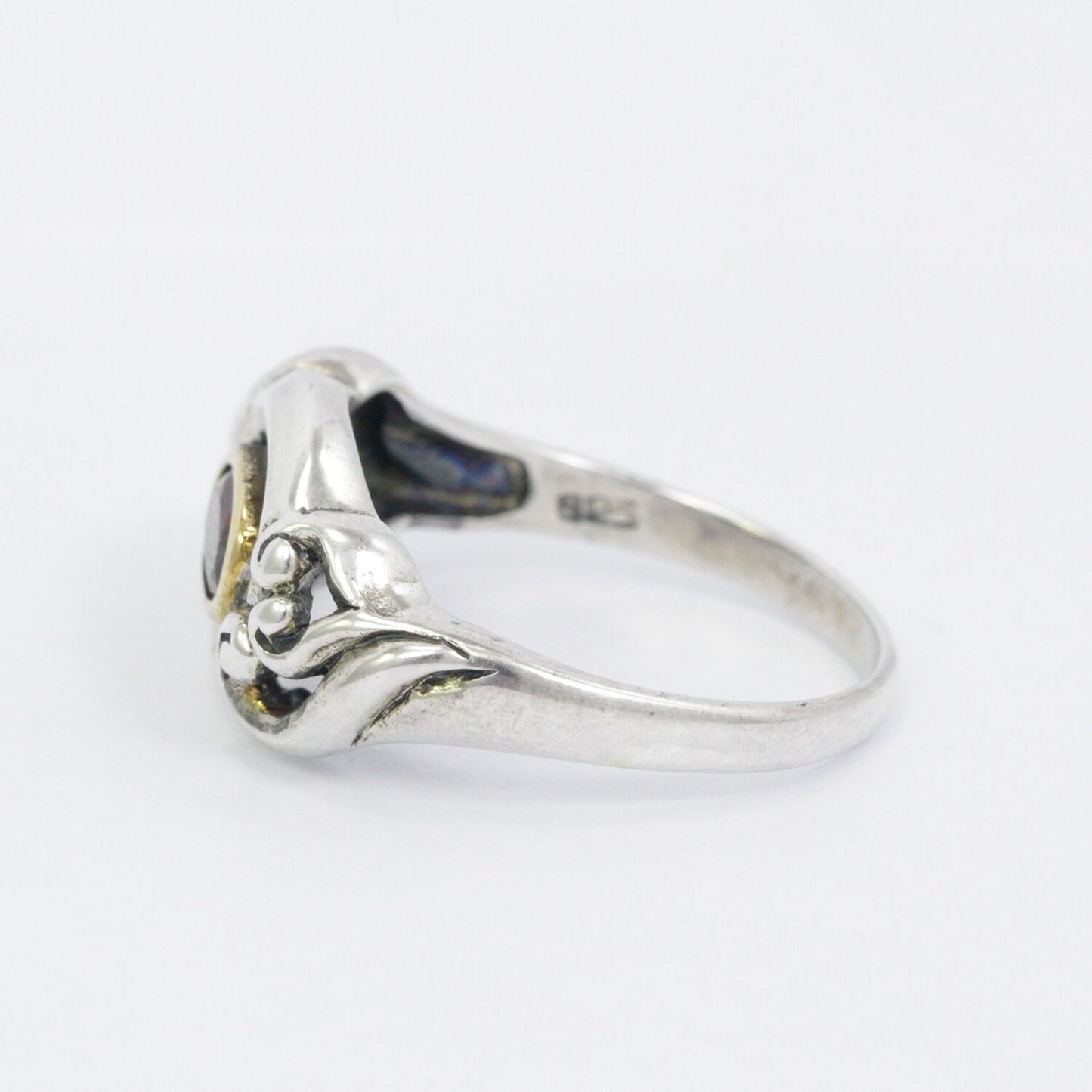 red garnet ring 925 sterling silver decorated with gold bezel and swirl filigree ornament