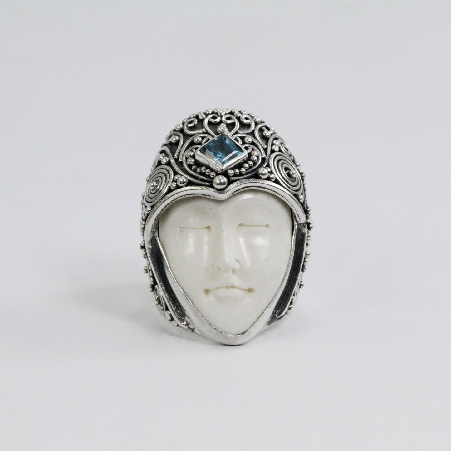face ring 925 sterling silver with genuine blue topaz and cow bone carving and filigree ornament