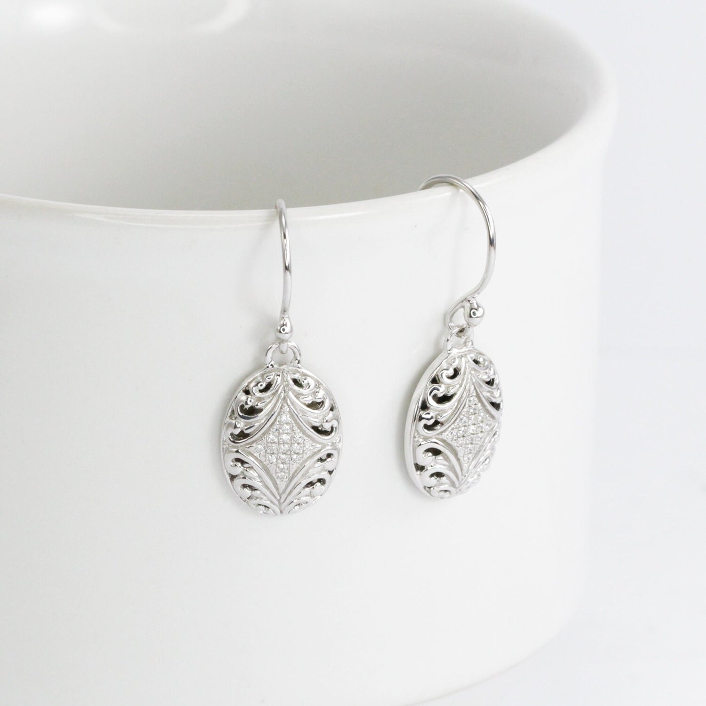oval earrings 925 sterling silver decorated with open work filigree and white zircon