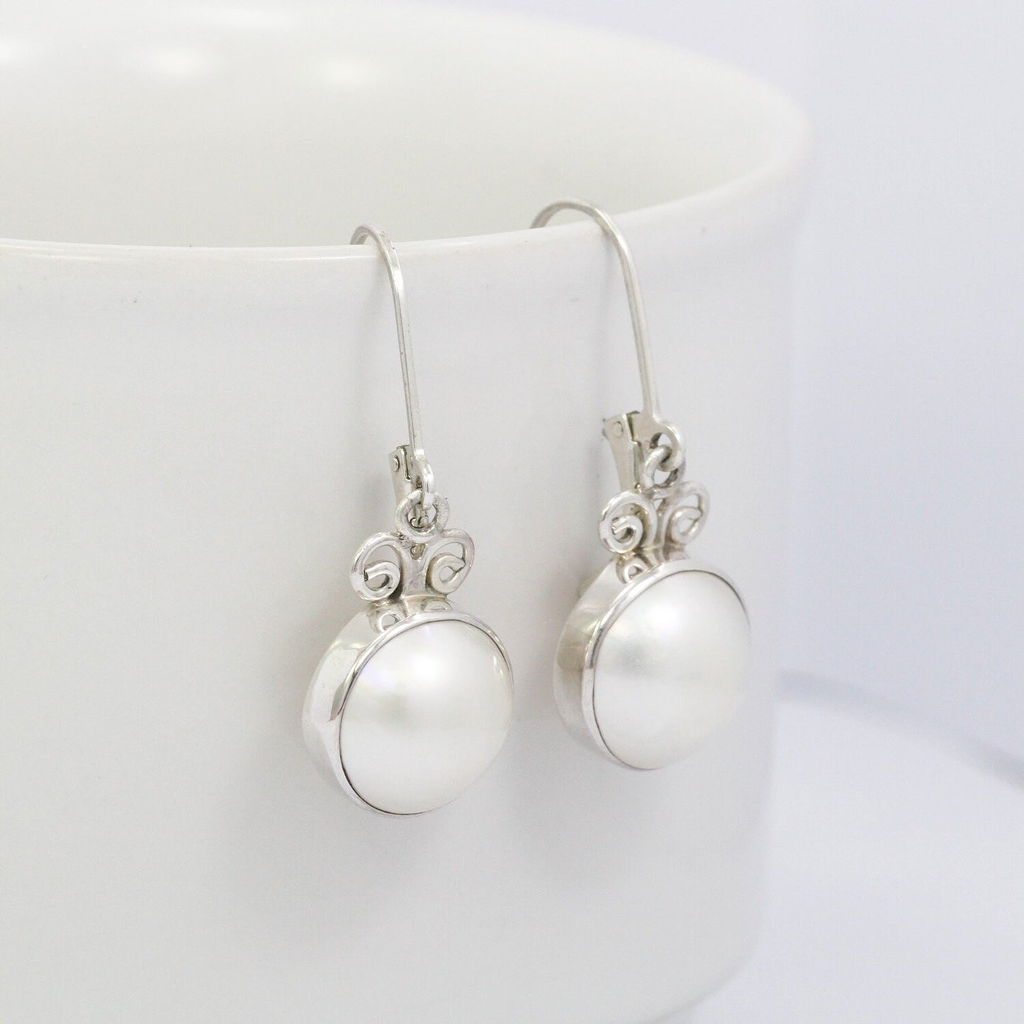 White mabe pearl earrings 925 sterling silver decorated with swirl filigree
