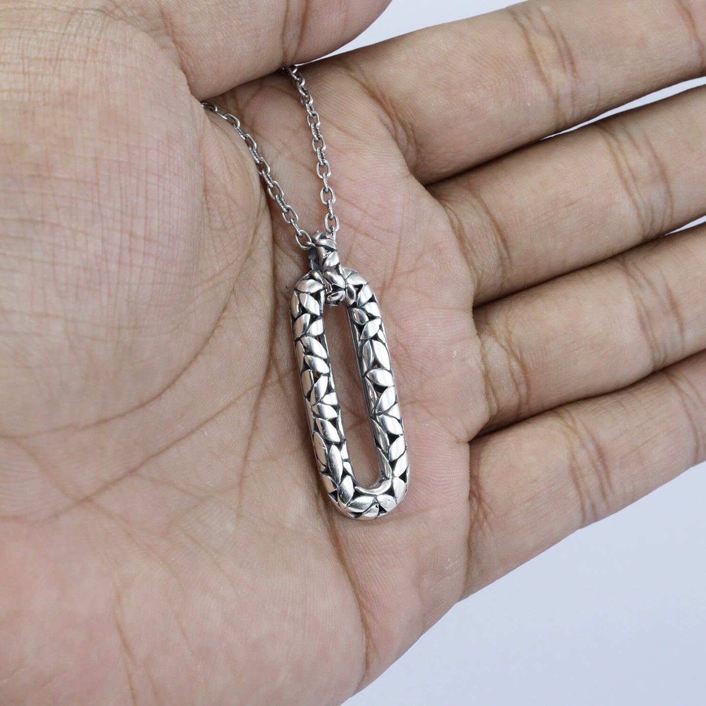 925 sterling silver rectangular pendant decorated with seed ornament and antique finishing