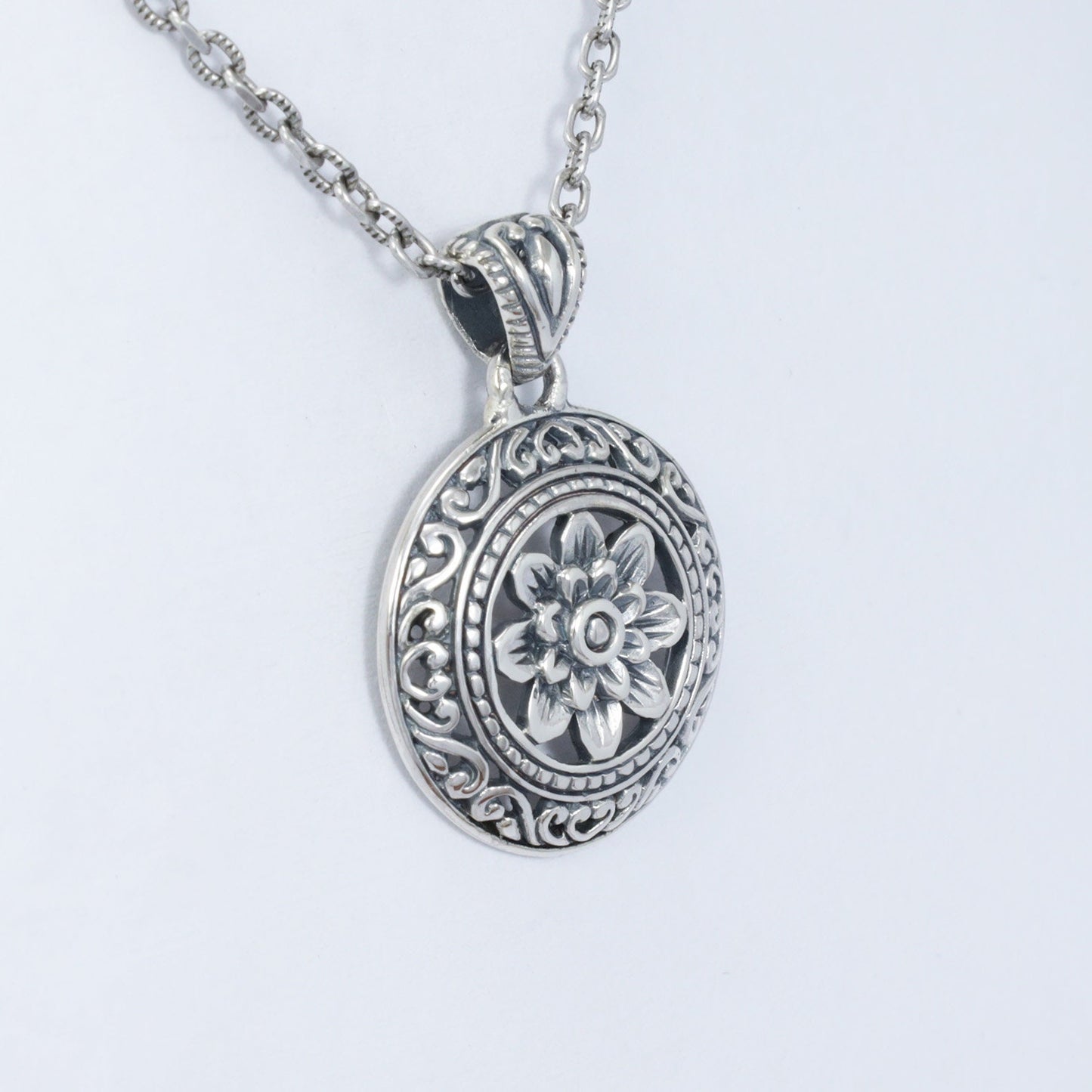 silver lotus flower pendant 925 sterling decorated with swirl filigree ornament and antique finishing