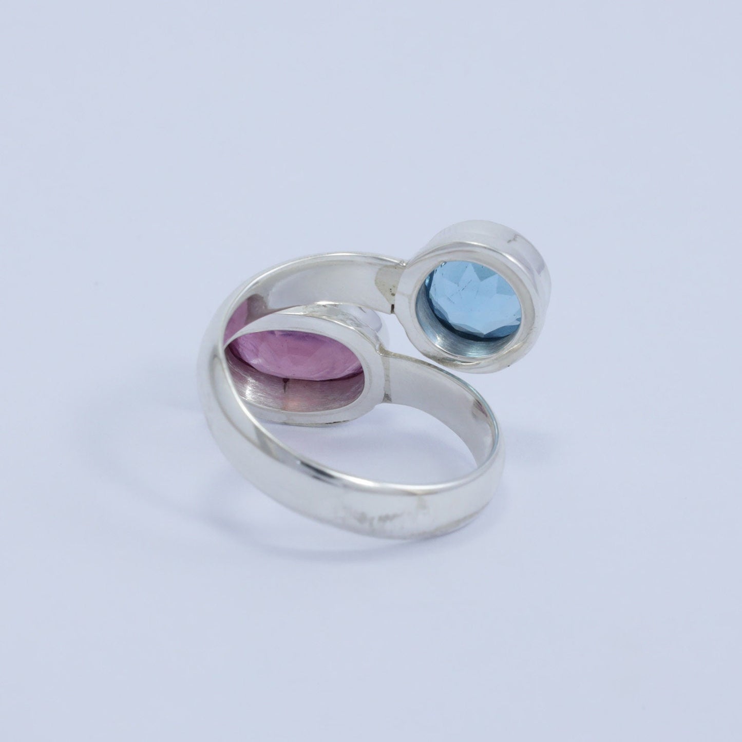 red ruby ring 925 sterling silver bypass style decorated with genuine blue topaz