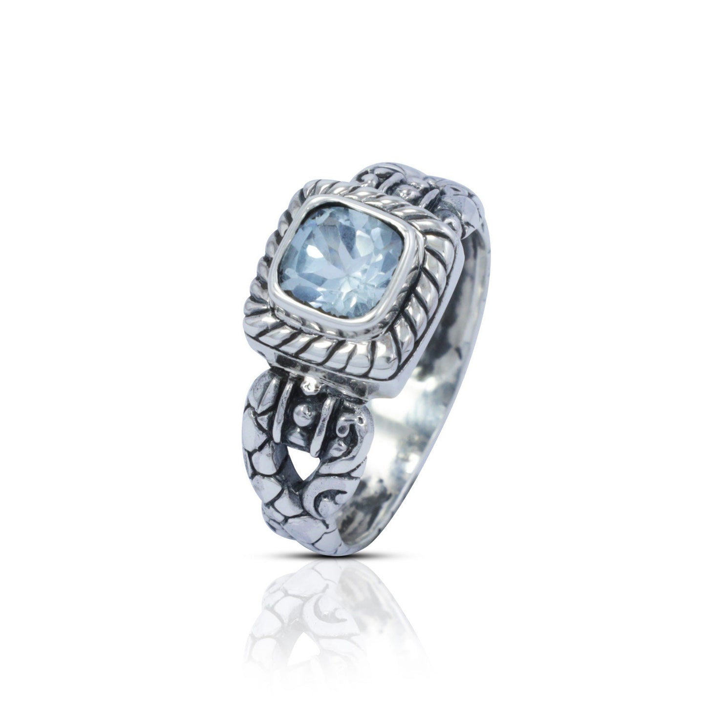 square ring with genuine blue topaz set in 925 sterling silver decorated with cable ornament